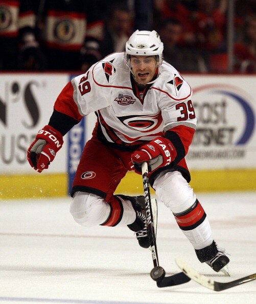 CHICAGO, IL - MARCH 04: Patrick Dwyer #39 of the Carolina Hurricanes chases down the puck against the Chicago Blackhawks at the United Center on March 4, 2011 in Chicago, Illinois. The Blackhawks defeated the Hurricanes 5-2. (Photo by Jonathan Daniel/Gett