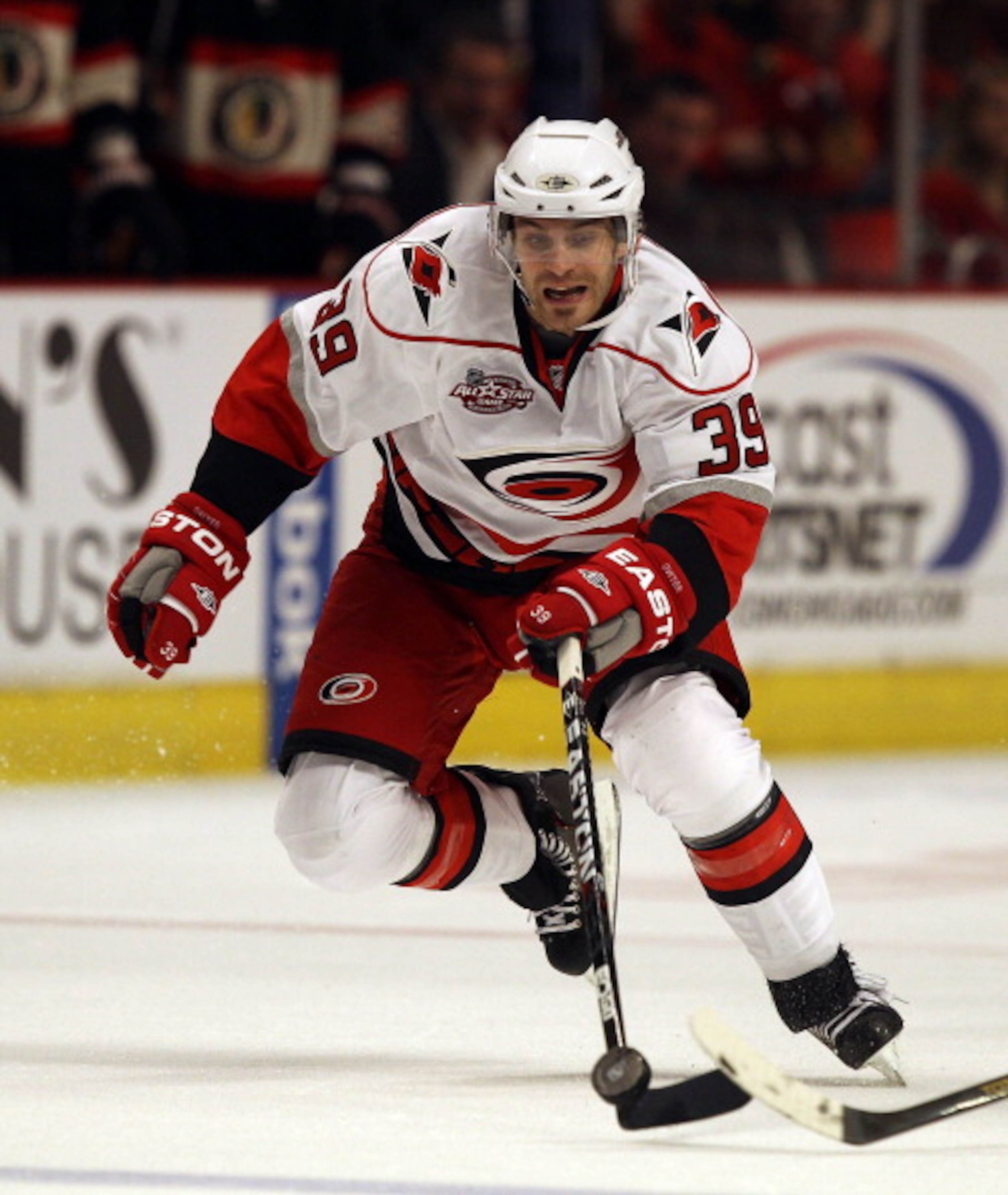 CHICAGO, IL - MARCH 04: Patrick Dwyer #39 of the Carolina Hurricanes chases down the puck against the Chicago Blackhawks at the United Center on March 4, 2011 in Chicago, Illinois. The Blackhawks defeated the Hurricanes 5-2. (Photo by Jonathan Daniel/Gett