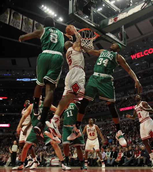 CHICAGO, IL - APRIL 07: Carlos Boozer #5 of the Chicago Bulls puts up a shot between Jeff Green #8 and Paul Pierce #34 of the Boston Celtics at United Center on April 7, 2011 in Chicago, Illinois. The Bulls defeated the Celtics 97-81. NOTE TO USER: User e