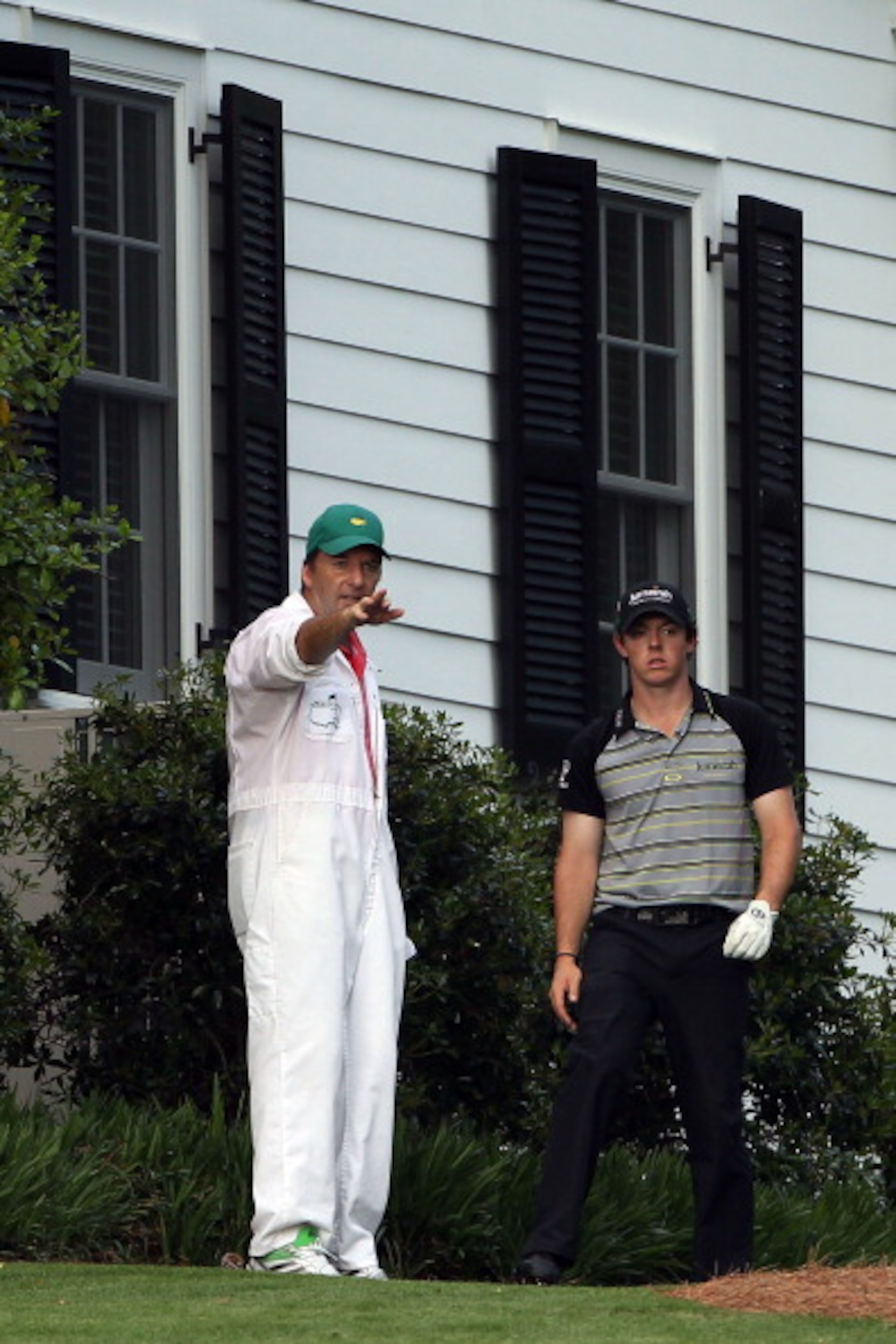 AUGUSTA, GA - APRIL 10:  Rory McIlroy of Northern Ireland waits to plays a shot on the tenth hole as his caddie J.P. Fitzgerald looks on during the final round of the 2011 Masters Tournament at Augusta National Golf Club on April 10, 2011 in Augusta, Geor