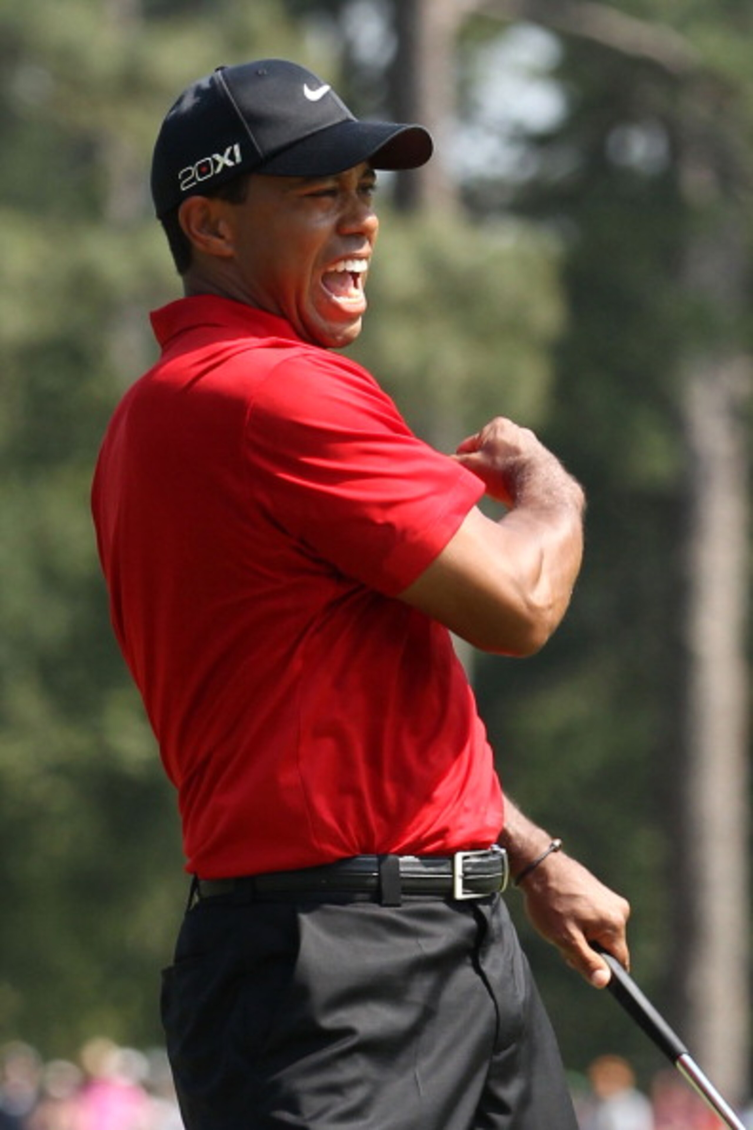 AUGUSTA, GA - APRIL 10:  Tiger Woods celebrates after holing a putt for eagle on the eighth green during the final round of the 2011 Masters Tournament on April 10, 2011 in Augusta, Georgia.  (Photo by Andrew Redington/Getty Images)
