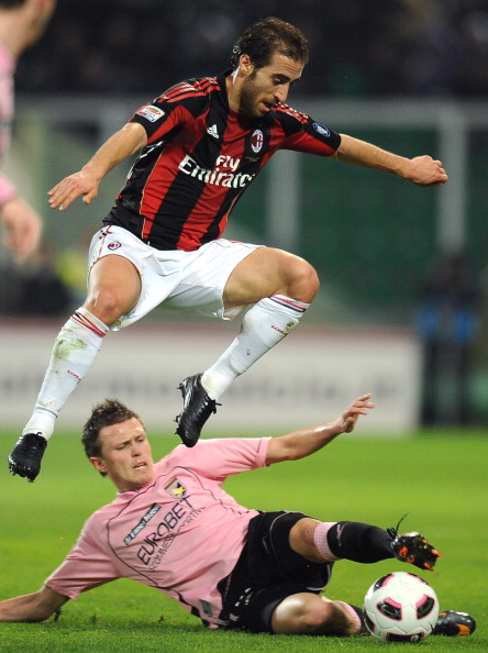 PALERMO, ITALY - MARCH 19:  Mathieu Flamini of AC Milan jumps over the tackle of Josip Ilicic of Palermo during the Serie A match between US Citta di Palermo and AC Milan at Stadio Renzo Barbera on March 19, 2011 in Palermo, Italy.  (Photo by Tullio M. Pu