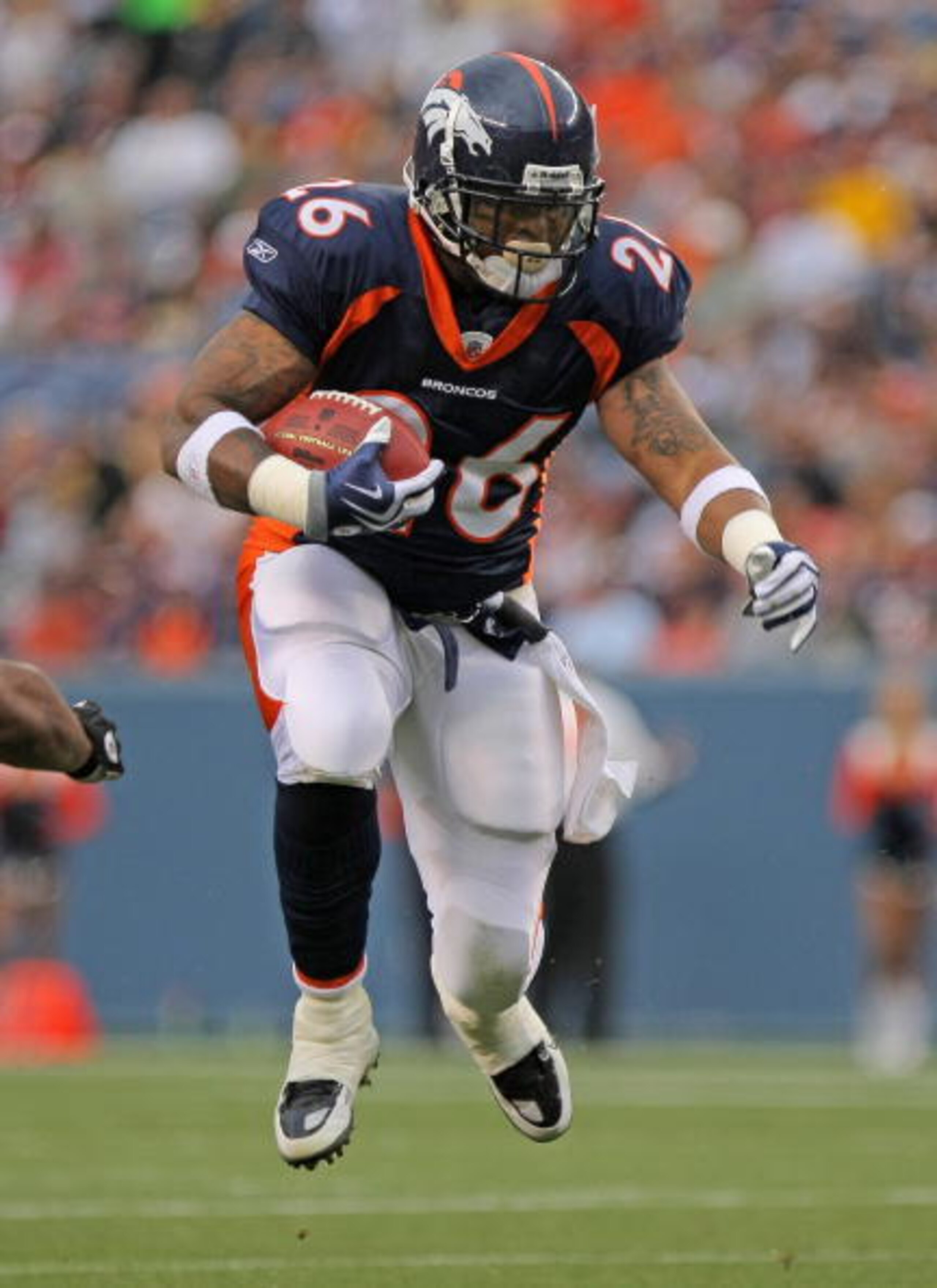 DENVER - AUGUST 29:  Running back LenDale White #26 of the Denver Broncos rushes against the Pittsburgh Steelers during preseason NFL action at INVESCO Field at Mile High on August 29, 2010 in Denver, Colorado.  (Photo by Doug Pensinger/Getty Images)