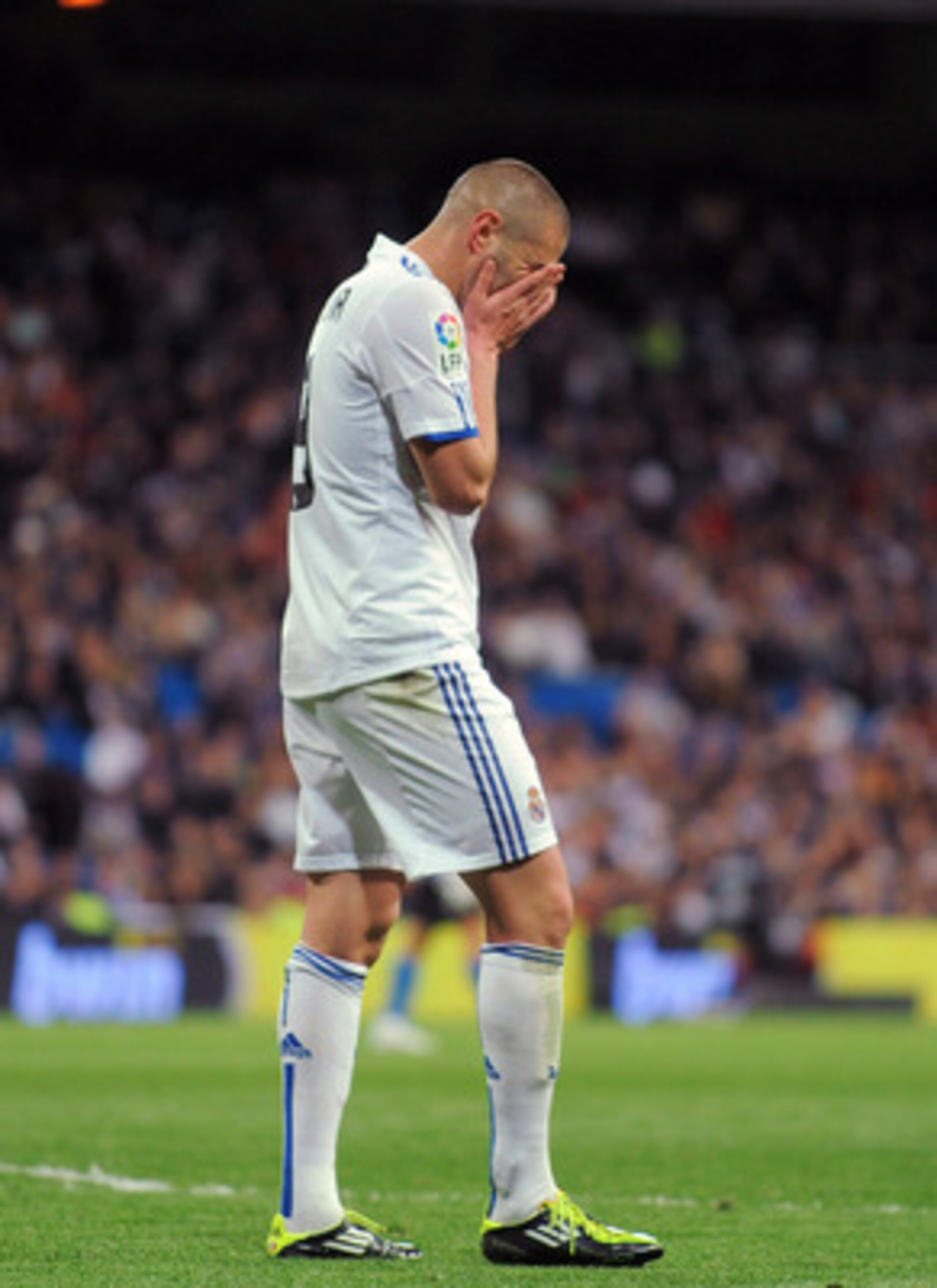 MADRID, SPAIN - MARCH 12:  Karim Benzema of Real Madrid reacts during the La Liga match between Real Madrid and Hercules CF at Estadio Santiago Bernabeu on March 12, 2011 in Madrid, Spain.  (Photo by Denis Doyle/Getty Images)