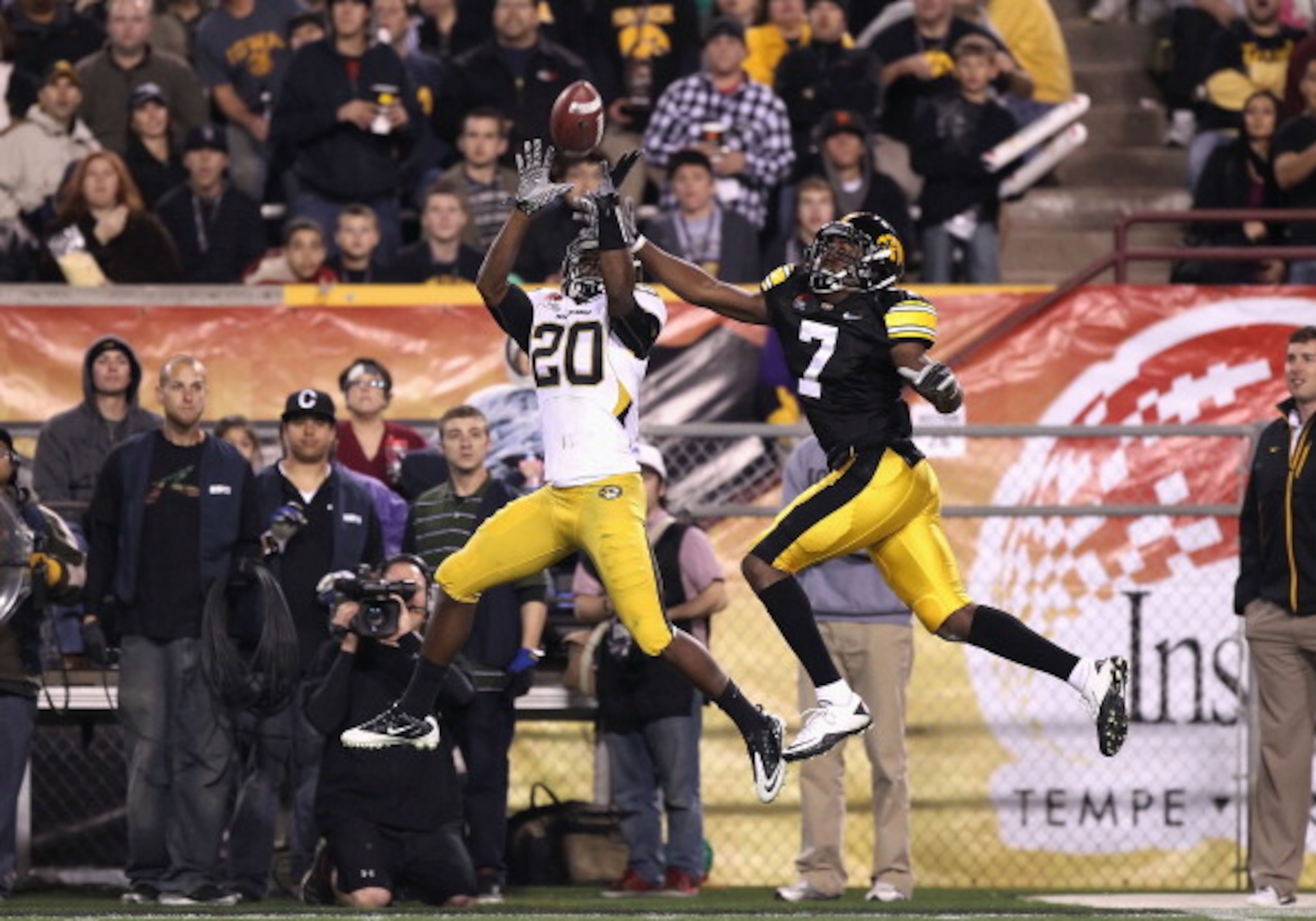 TEMPE, AZ - DECEMBER 28: Defensive back Kevin Rutland #20 of the Missouri Tigers intercepts a pass intended for Marvin McNutt #7 of the Iowa Hawkeyes during the third quarter of the Insight Bowl at Sun Devil Stadium on December 28, 2010 in Tempe, Arizona TEMPE, AZ - DECEMBER 28: Defensive back Kevin Rutland #20 of the Missouri Tigers intercepts a pass intended for Marvin McNutt #7 of the Iowa Hawkeyes during the third quarter of the Insight Bowl at Sun Devil Stadium on December 28, 2010 in Tempe, Arizona