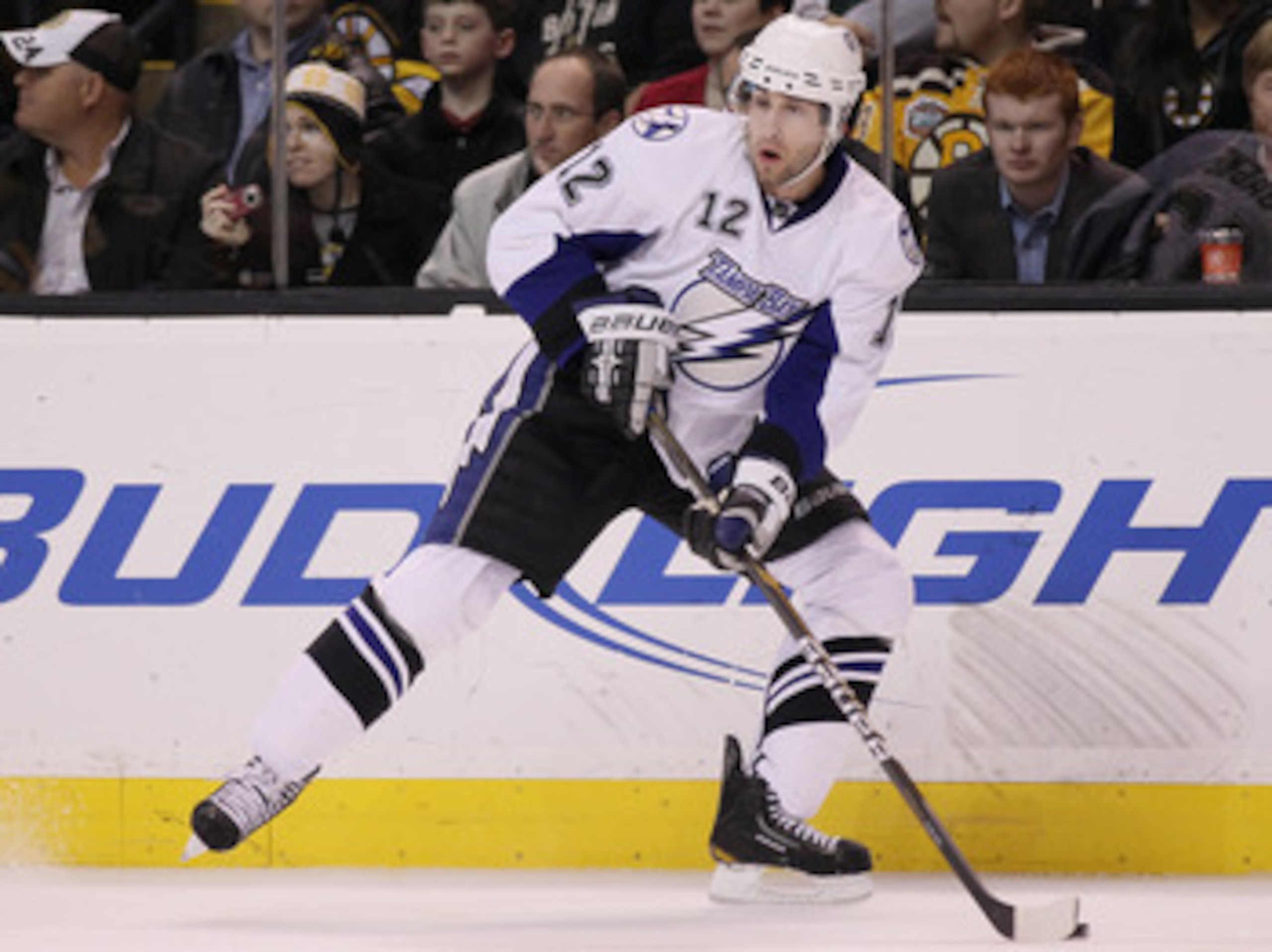 BOSTON, MA - MARCH 03:  Simon Gagne #12 of the Tampa Bay Lightning looks to pass in the second period against the Boston Bruins on March 3, 2011 at the TD Garden in Boston, Massachusetts.  (Photo by Elsa/Getty Images)
