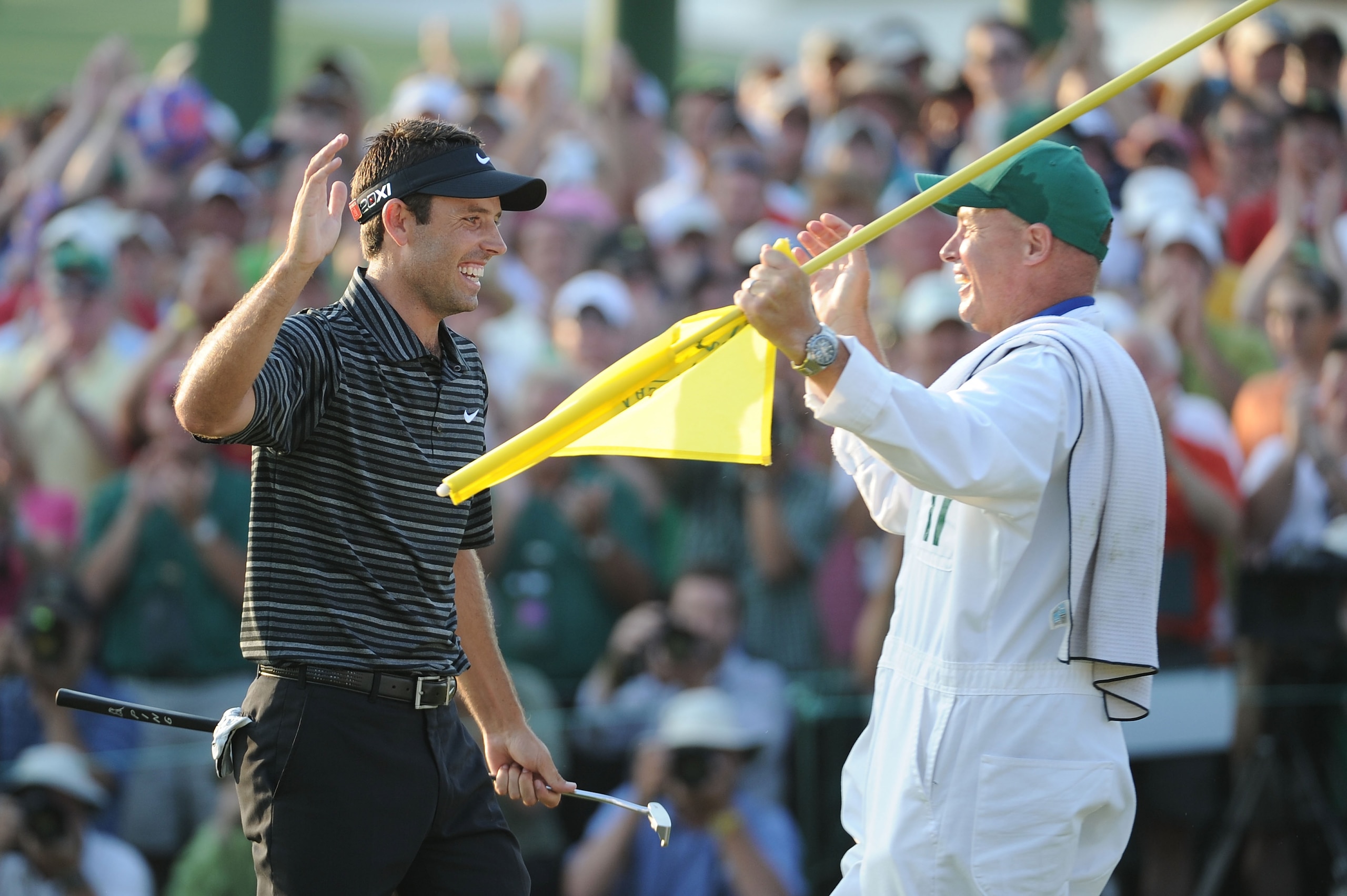 AUGUSTA, GA - APRIL 10: Charl Schwartzel of South Africa celebrates his two-stroke victory with his caddie Greg Hearmon on the 18th green during the final round of the 2011 Masters Tournament at Augusta National Golf Club on April 10, 2011 in Augusta, Ge AUGUSTA, GA - APRIL 10: Charl Schwartzel of South Africa celebrates his two-stroke victory with his caddie Greg Hearmon on the 18th green during the final round of the 2011 Masters Tournament at Augusta National Golf Club on April 10, 2011 in Augusta, Ge