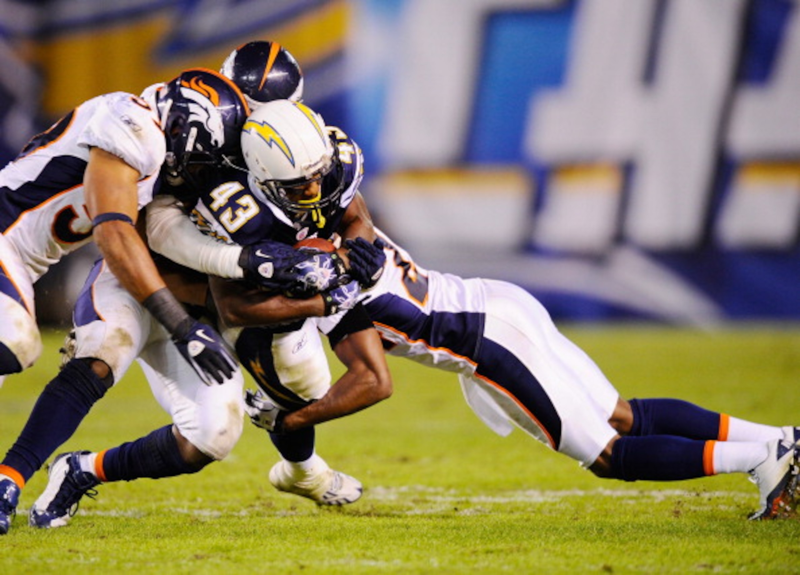 SAN DIEGO - NOVEMBER 22: Darren Sproles #43 of the San Diego Chargers is tackled by group of Denver Broncos defenders at Qualcomm Stadium on November 22, 2010 in San Diego, California.  Chargers defeated the Broncos, 35-14.  (Photo by Kevork Djansezian/Ge