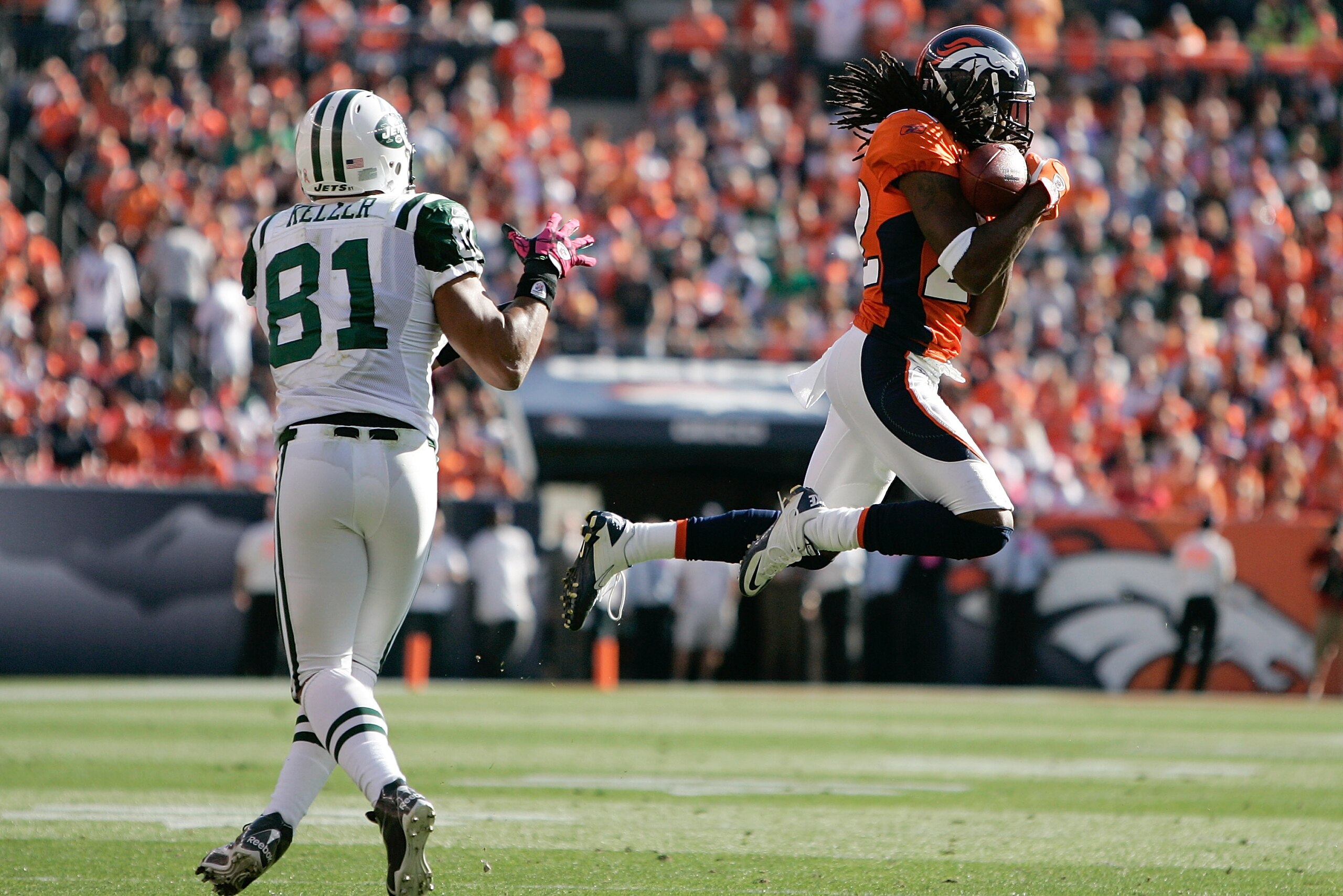 DENVER - OCTOBER 17:  Corberback Syd'Quan Thompson #22 the Denver Broncos intercepts a pass intended for tight end Dustin Keller #81 of the New York Jets at INVESCO Field at Mile High on October 17, 2010 in Denver, Colorado.  (Photo by Justin Edmonds/Gett