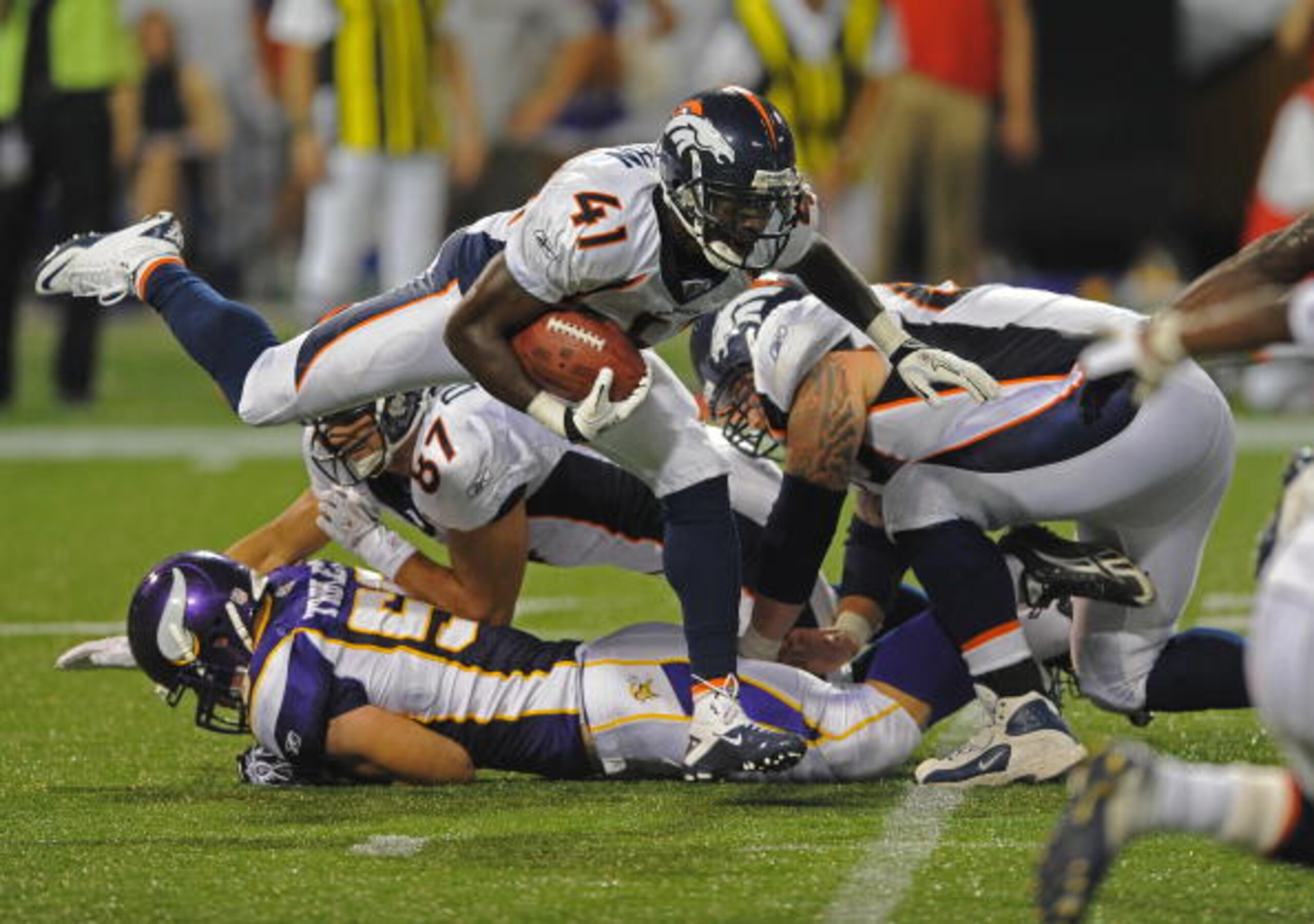 MINNEAPOLIS - SEPTEMBER 02:  Cassius Vaughn #41 of the Denver Broncos carries the ball during an NFL preseason game against the Minnesota Vikings at the Mall of America Field at Hubert H. Humphrey Metrodome, on September 2, 2010 in Minneapolis, Minnesota.