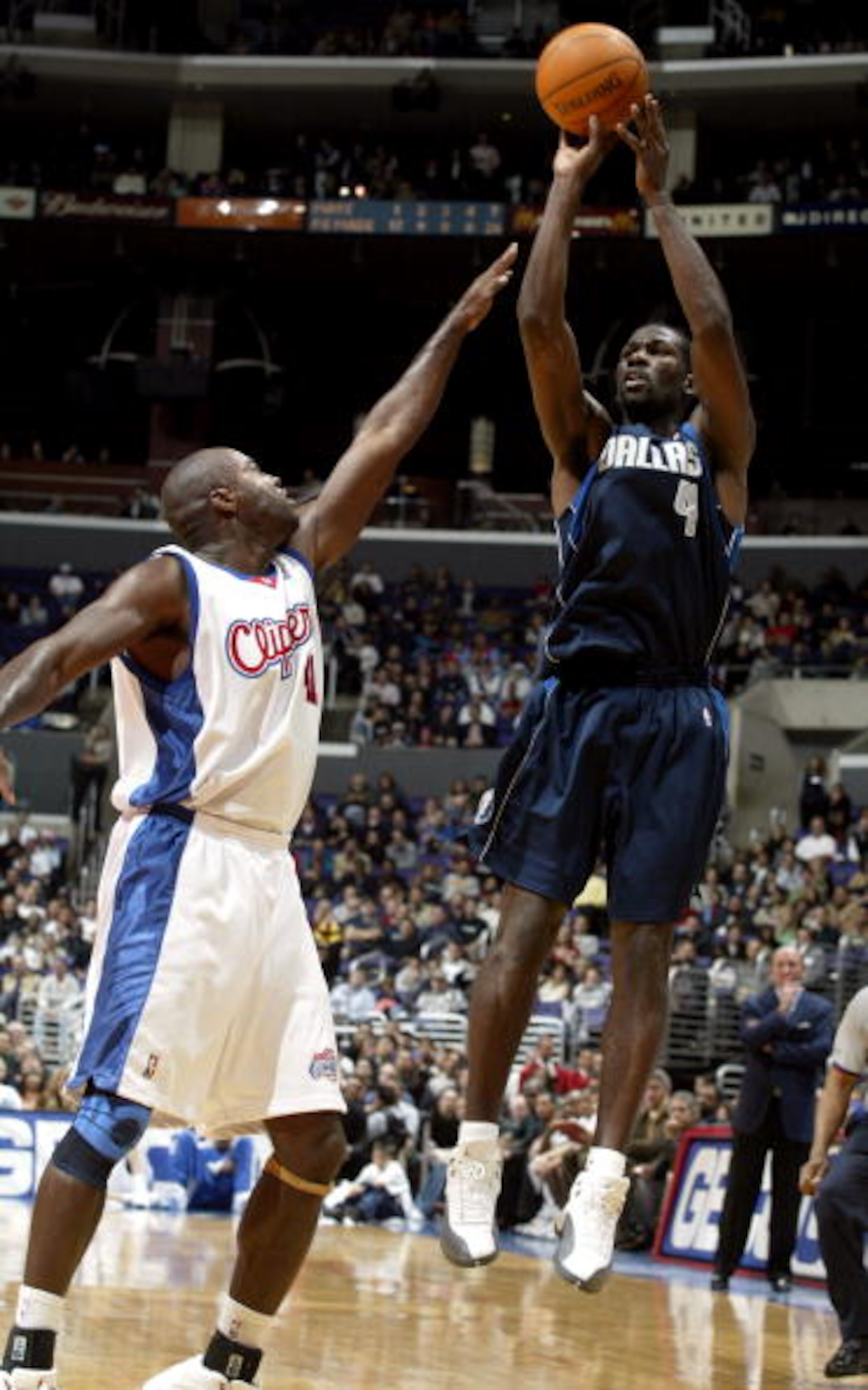 LOS ANGELES - DECEMBER 10:  Michael Finley #4 of the Dallas Mavericks shoots over Glen Rice #41 of the Los Angeles Clippers December 10, 2003 at Staples Center in Los Angeles, California.  NOTE TO USER: User expressly acknowledges and agrees that, by down