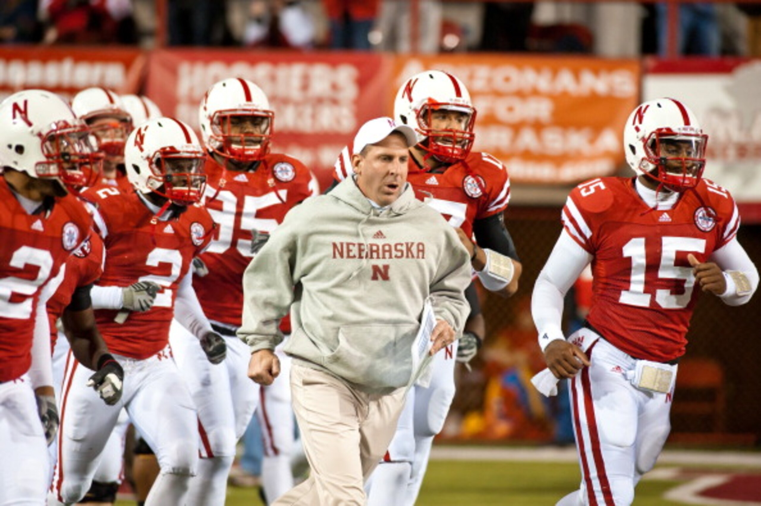 LINCOLN, NE - NOVEMBER 13: Coach Bo Pelini of the Nebraska Cornhuskers leads his team onto the field to play the Kansas Jayhawks at Memorial Stadium on November 13, 2010 in Lincoln, Nebraska. Nebraska Defeated Kansas 20-3. (Photo by Eric Francis/Getty Ima
