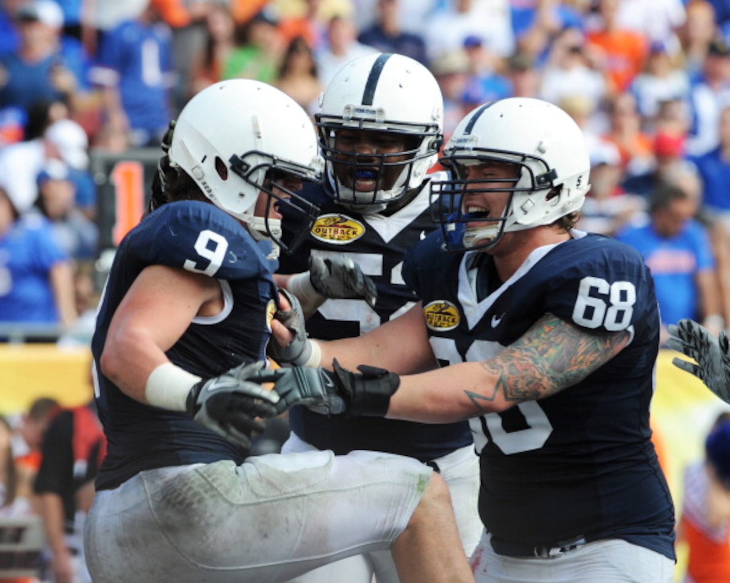 TAMPA, FL - JANUARY 1:  Running back Michael Zordich #9 of the Penn State Nittany Lions celebrates a score with center Doug Klopacz #68 against the Florida Gators January 1, 2010 in the 25th Outback Bowl at Raymond James Stadium in Tampa, Florida.  (Photo