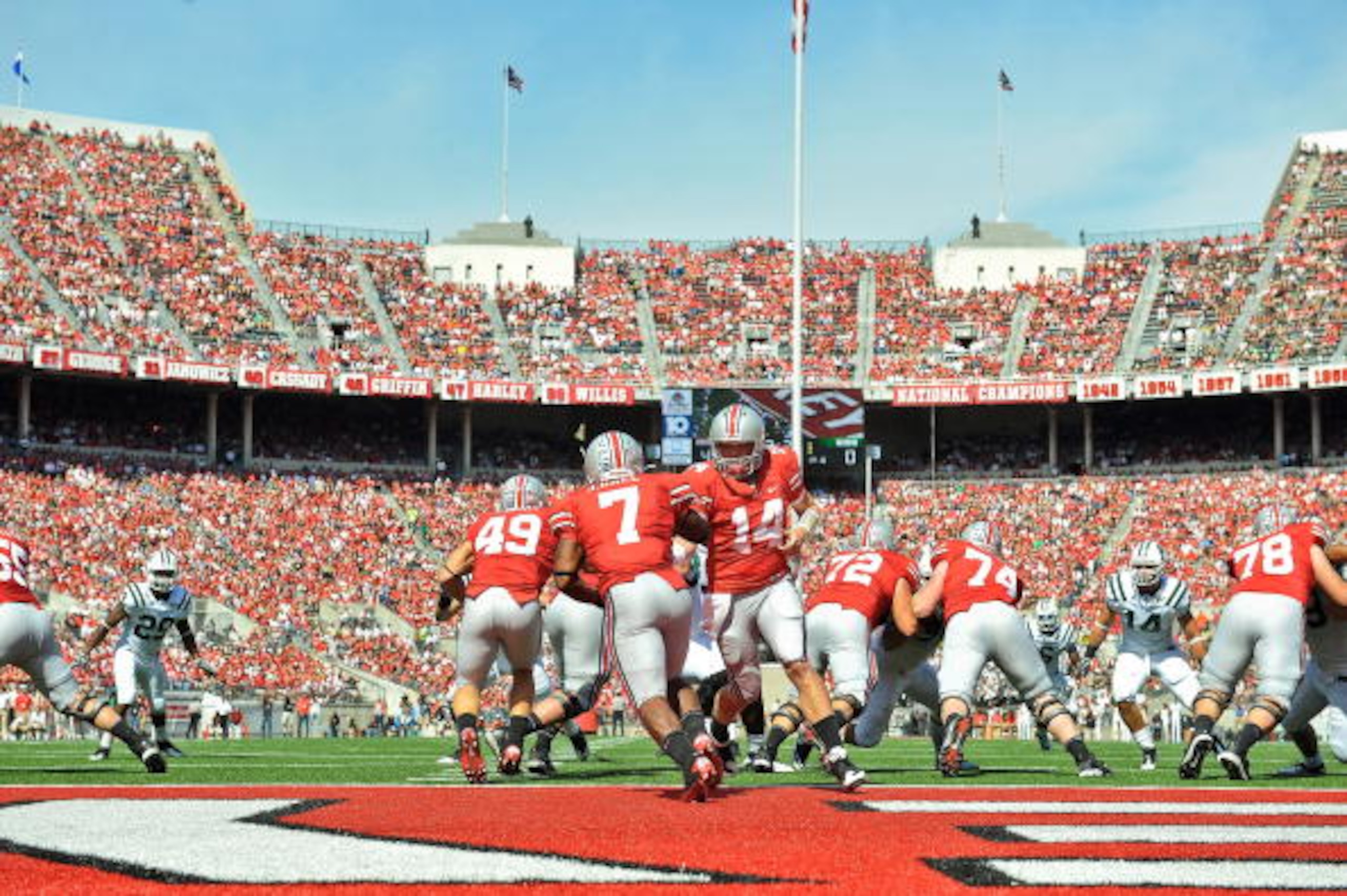 COLUMBUS, OH - SEPTEMBER 18:  Quarterback Joe Bauserman #14 of the Ohio State Buckeyes hands off the ball to Jordan Hall #7 of the Ohio State Buckeyes against the Ohio Bobcats at Ohio Stadium on September 18, 2010 in Columbus, Ohio.  (Photo by Jamie Sabau