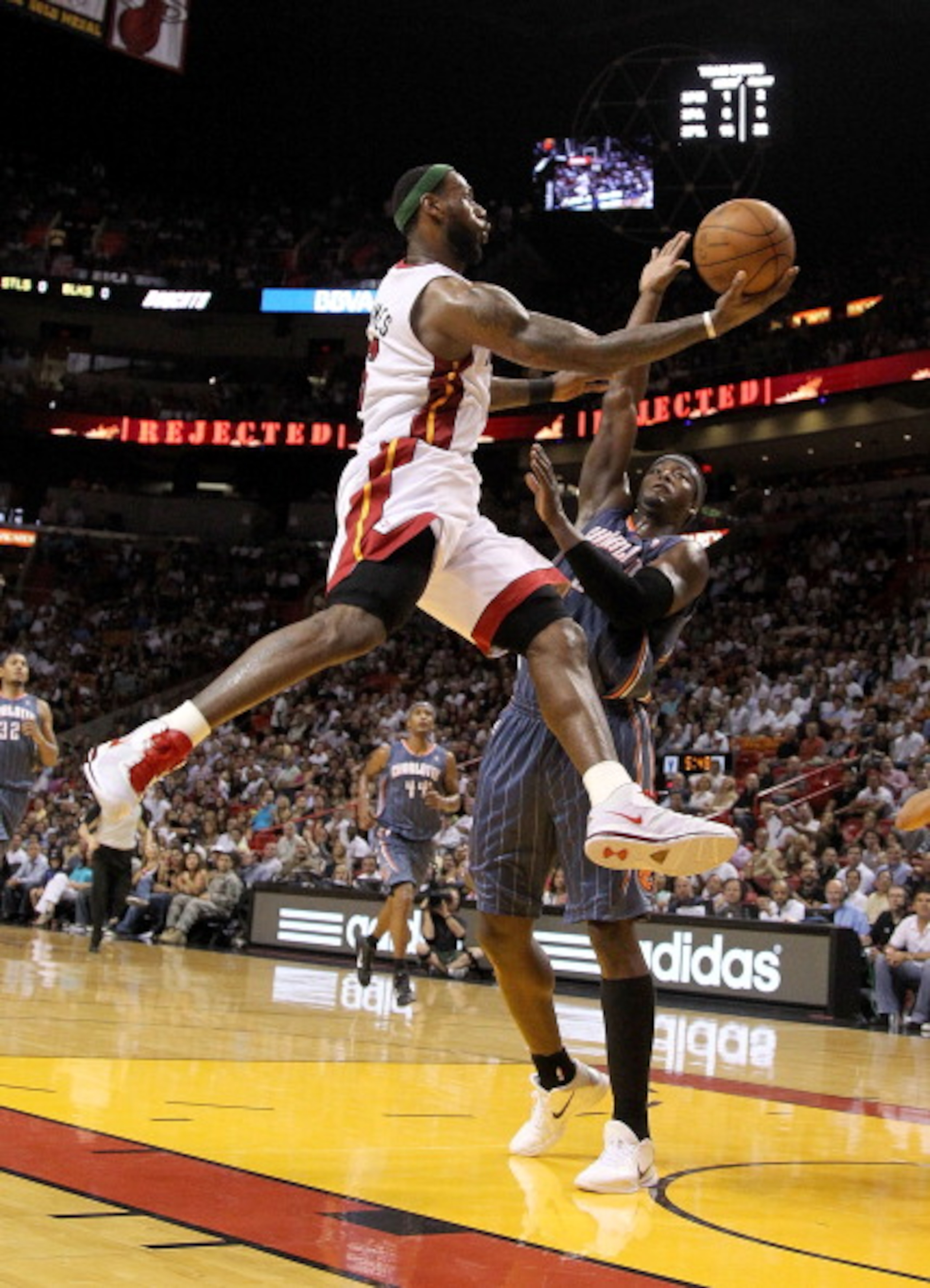 MIAMI, FL - APRIL 08:  LeBron James #6 of the Miami Heat drives against Kwame Brown #54 of the Charlotte Bobcats during a game at American Airlines Arena on April 8, 2011 in Miami, Florida. NOTE TO USER: User expressly acknowledges and agrees that, by dow