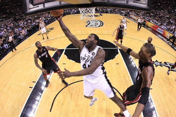 SAN ANTONIO, TX - MARCH 04:  Forward DeJuan Blair #45 of the San Antonio Spurs takes a shot against Chris Bosh #1 of the Miami Heat at AT&T Center on March 4, 2011 in San Antonio, Texas.   NOTE TO USER: User expressly acknowledges and agrees that, by down