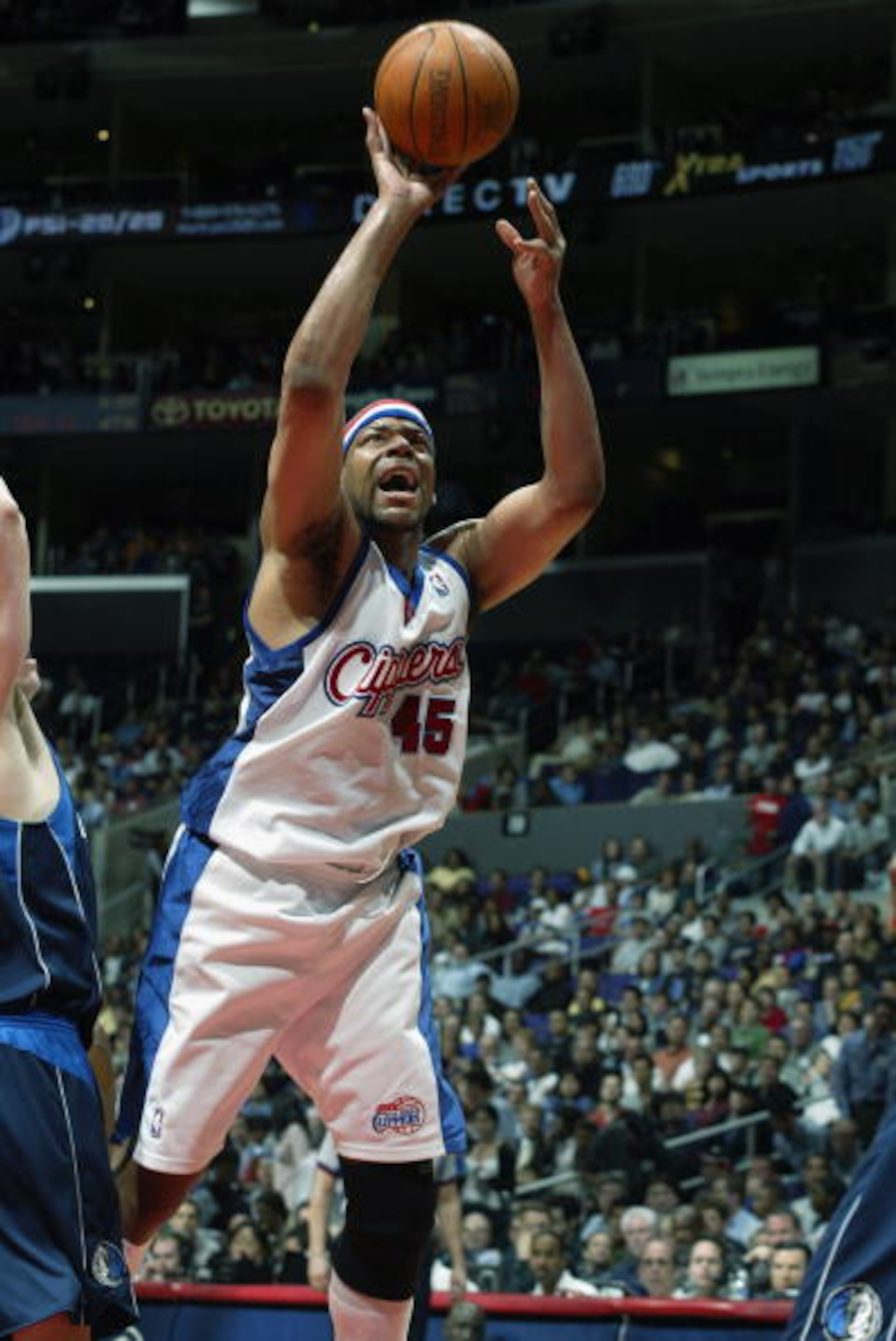 LOS ANGELES - MARCH 26:  Sean Rooks #45 of the Los Angeles Clippers puts a shot up during the game against the Dallas Mavericks on March 26, 2003 at Staples Center in Los Angeles, California.  The Mavericks won 114-107.  NOTE TO USER: User expressly ackno