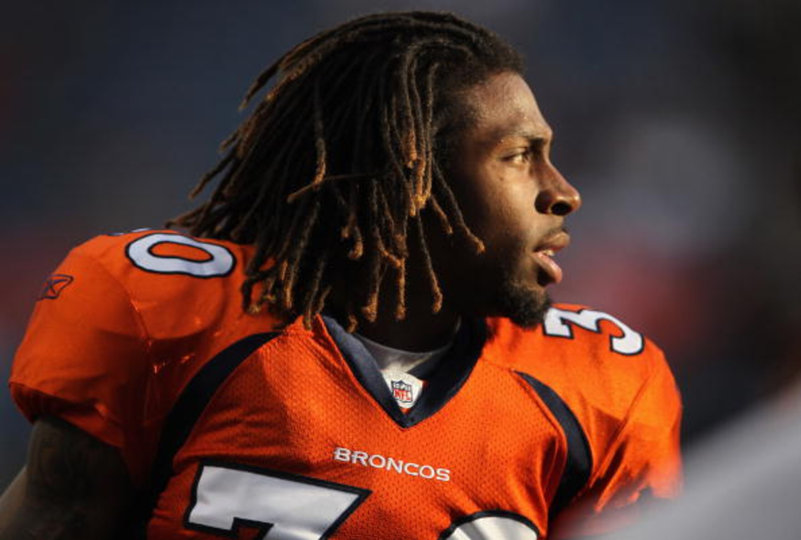 DENVER - AUGUST 21:  Safety David Bruton #30 of the Denver Broncos warms up prior to facing the Detroit Lions during preseason NFL action at INVESCO Field at Mile High on August 21, 2010 in Denver, Colorado. The Lions defeated the Broncos 25-20.  (Photo b