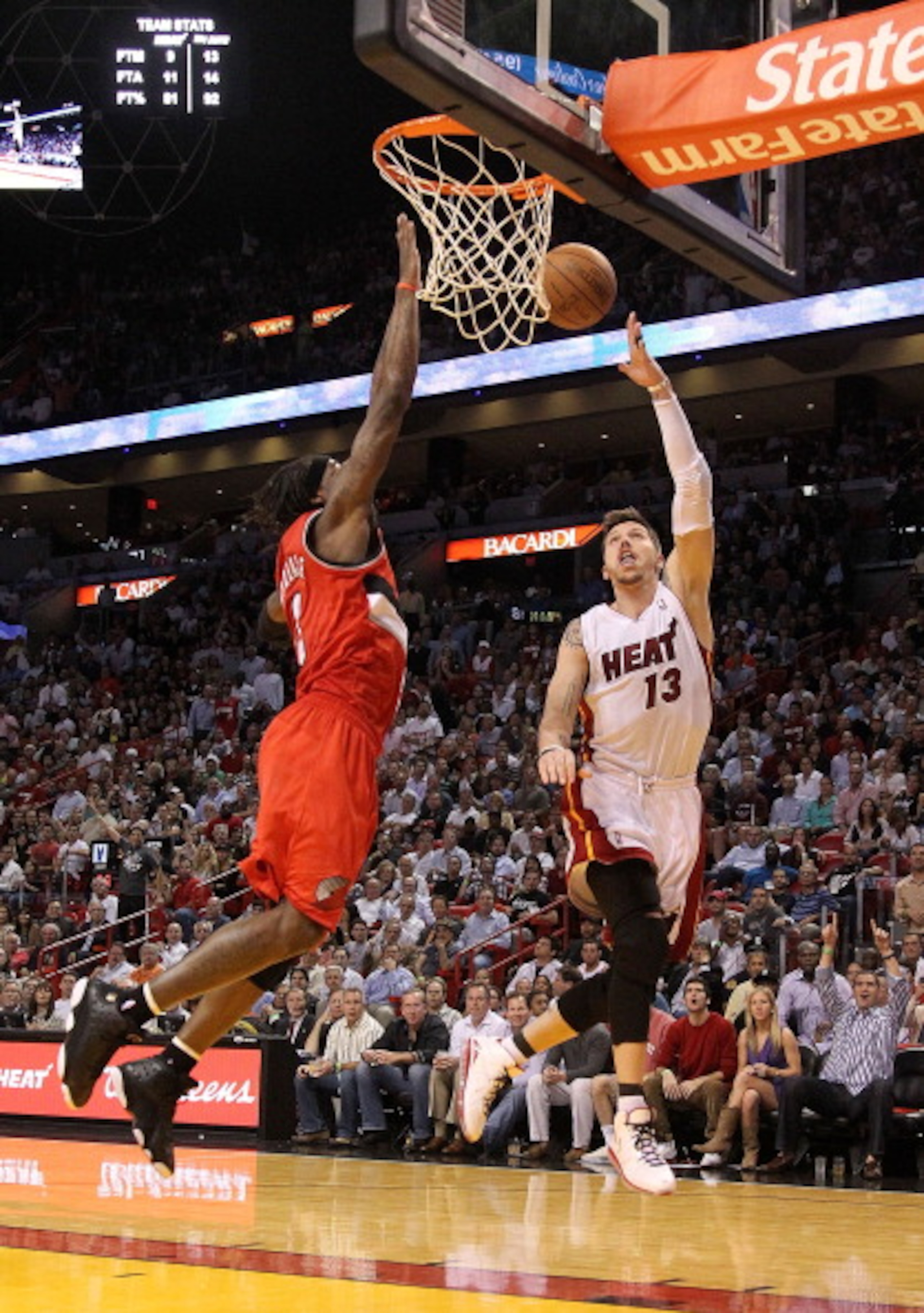 MIAMI, FL - MARCH 08: Mike Miller #13 of the Miami Heat drives on Gerald Wallace #3 of the Portland Trail Blazers during a game at American Airlines Arena on March 8, 2011 in Miami, Florida. NOTE TO USER: User expressly acknowledges and agrees that, by MIAMI, FL - MARCH 08: Mike Miller #13 of the Miami Heat drives on Gerald Wallace #3 of the Portland Trail Blazers during a game at American Airlines Arena on March 8, 2011 in Miami, Florida. NOTE TO USER: User expressly acknowledges and agrees that, by