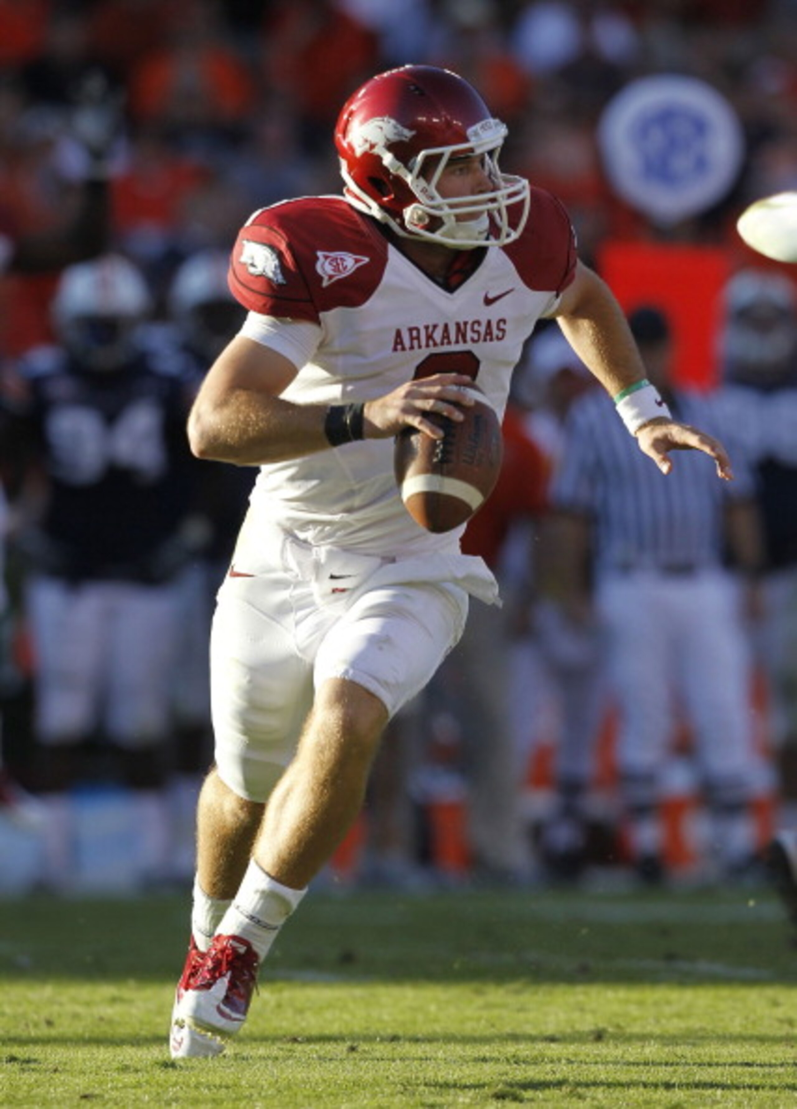 AUBURN, AL - OCTOBER 16:  Quarterback Tyler Wilson #8 of the Arkansas Razorbacks rolls out and looks downfield for a receiver during the game against the Auburn Tigers at Jordan-Hare Stadium on October 16, 2010 in Auburn, Alabama.  The Tigers beat the Raz