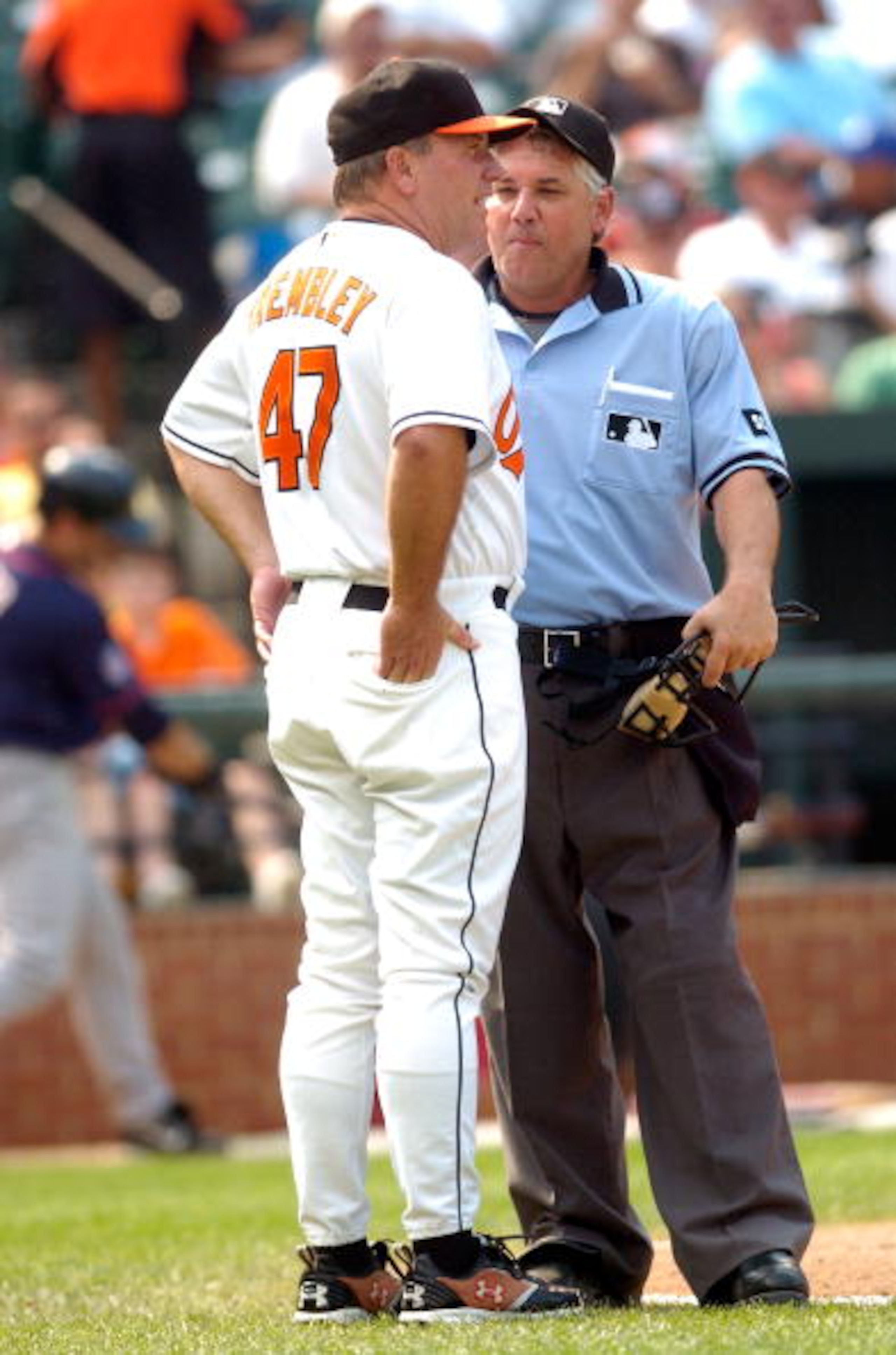 BALTIMORE- AUGUST 26:  Manager Dave Trembley #47 of the Baltimore Orioles argues with home plate umpire Tom Hallion during a game against the Minnesota Twins at Camden Yards August 26, 2007 in Baltimore, Maryland.  (Photo by Greg Fiume/Getty Images)