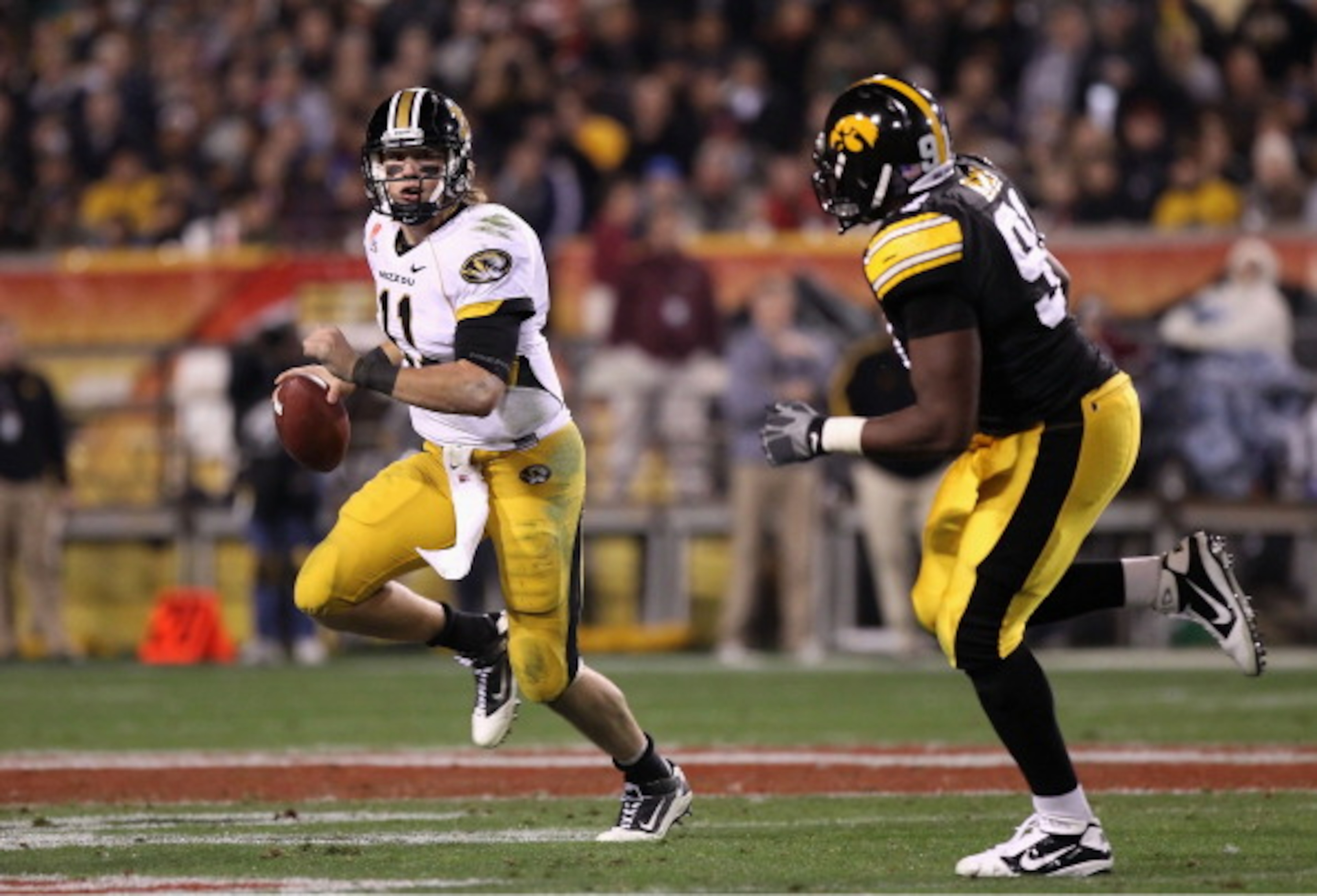TEMPE, AZ - DECEMBER 28:  Quarterback Blaine Gabbert #11 of the Missouri Tigers drops back to pass during the Insight Bowl against the Iowa Hawkeyes  at Sun Devil Stadium on December 28, 2010 in Tempe, Arizona.  The Hawkeyes defeated the Tigers 27-24.  (P