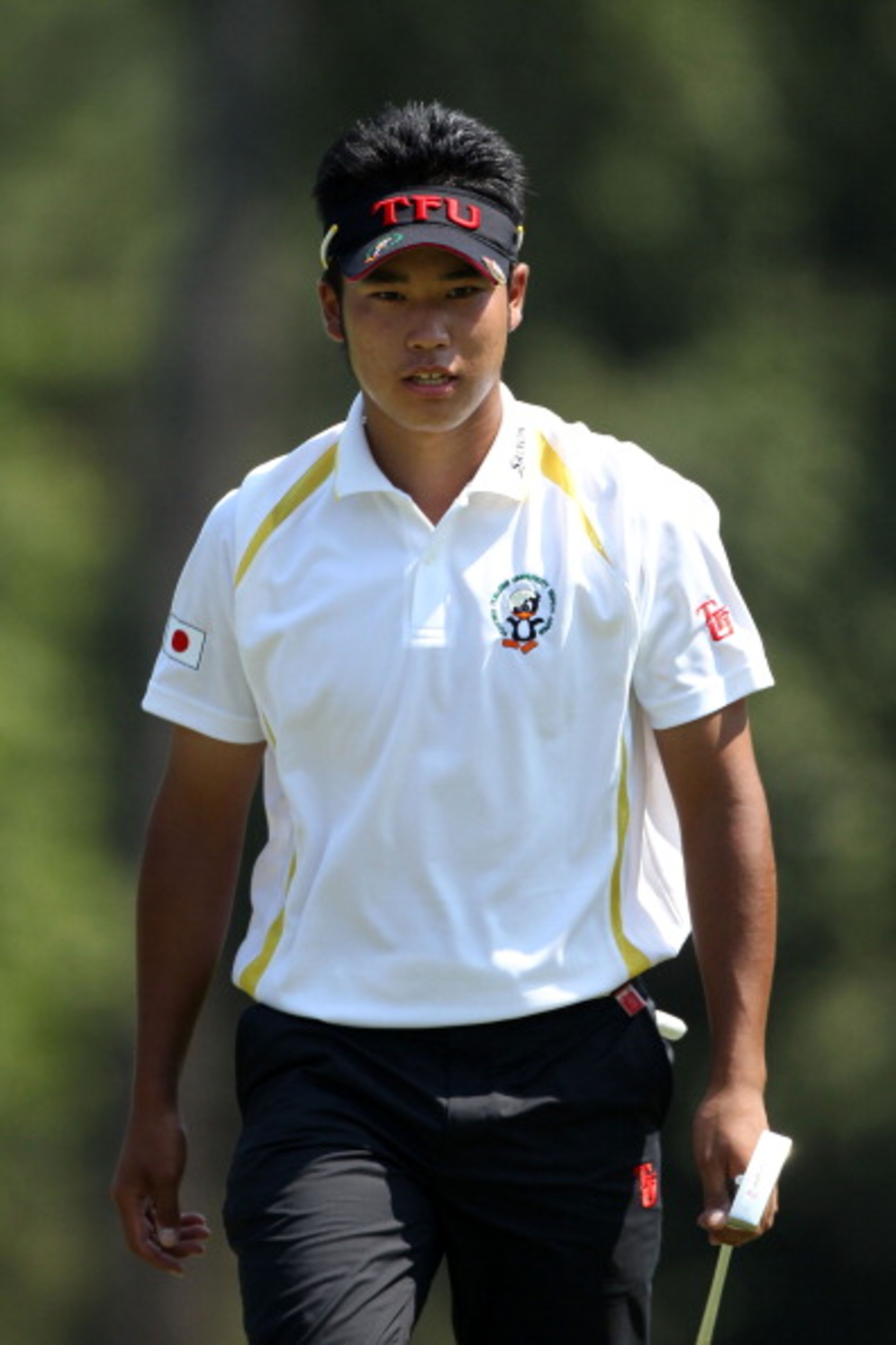 AUGUSTA, GA - APRIL 10:  Amateur Hideki Matsuyama of Japan walks across the eighth green during the final round of the 2011 Masters Tournament on April 10, 2011 in Augusta, Georgia.  (Photo by Andrew Redington/Getty Images)