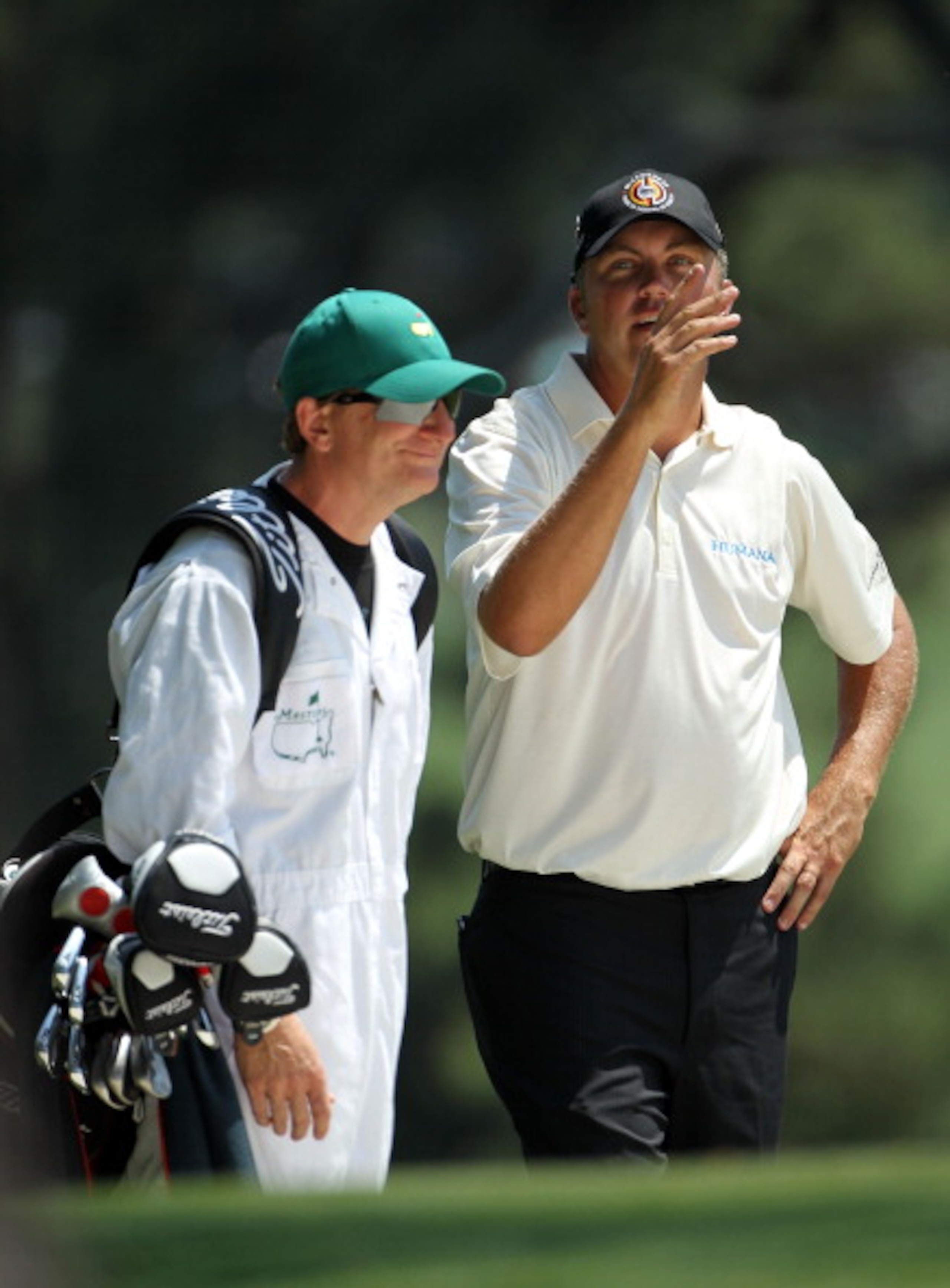 AUGUSTA, GA - APRIL 10:  Bo Van Pelt chats with his caddie Mark Chaney on the first hole during the final round of the 2011 Masters Tournament at Augusta National Golf Club on April 10, 2011 in Augusta, Georgia.  (Photo by Jamie Squire/Getty Images)