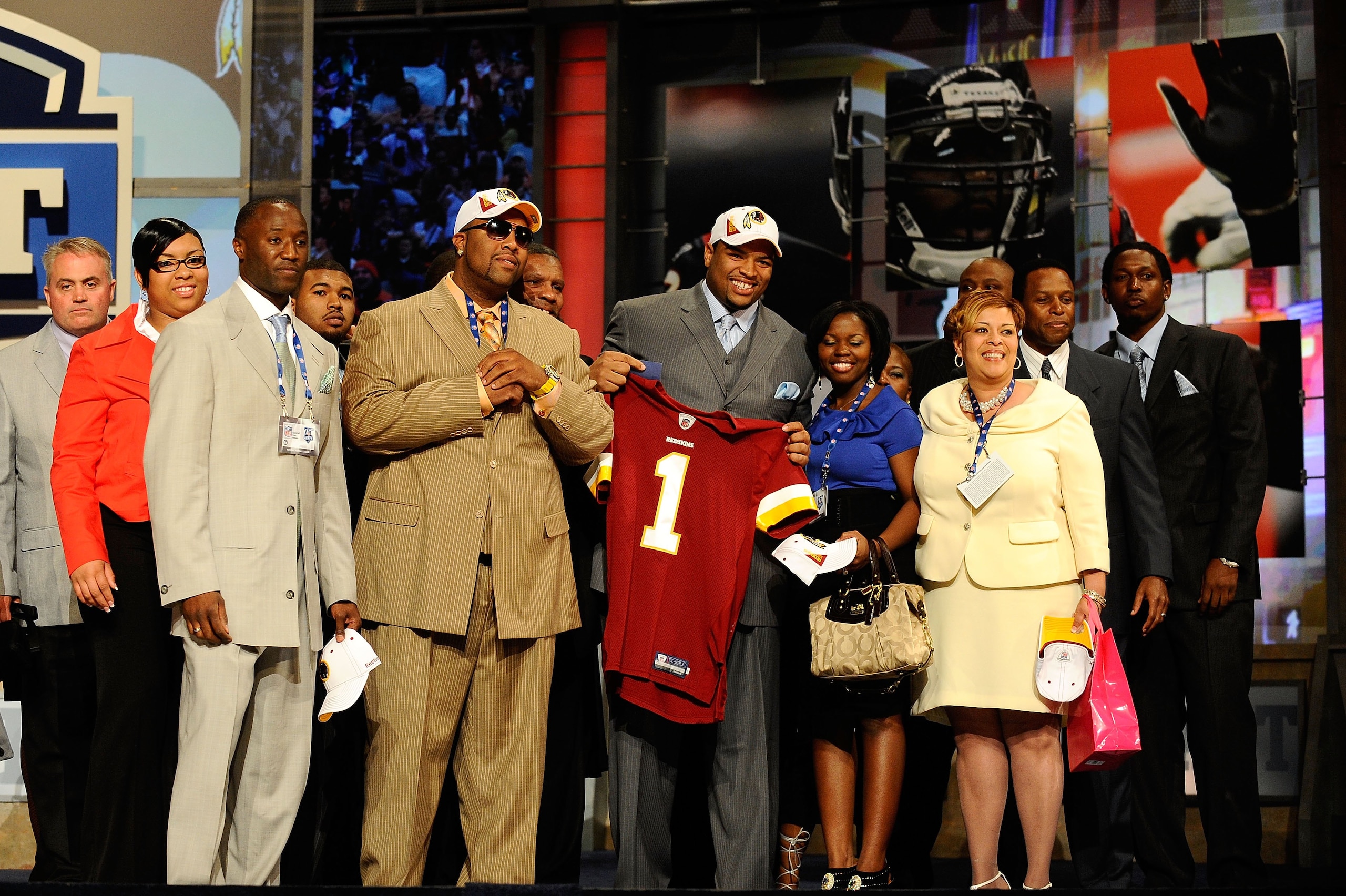 NEW YORK - APRIL 22: Trent Williams of the Oklahoma Sooners holds a Washington Redskins jersey as he poses with friends and family after Washington selected Williams #4 overall in the first round during the 2010 NFL Draft at Radio City Music Hall on Apri NEW YORK - APRIL 22: Trent Williams of the Oklahoma Sooners holds a Washington Redskins jersey as he poses with friends and family after Washington selected Williams #4 overall in the first round during the 2010 NFL Draft at Radio City Music Hall on Apri