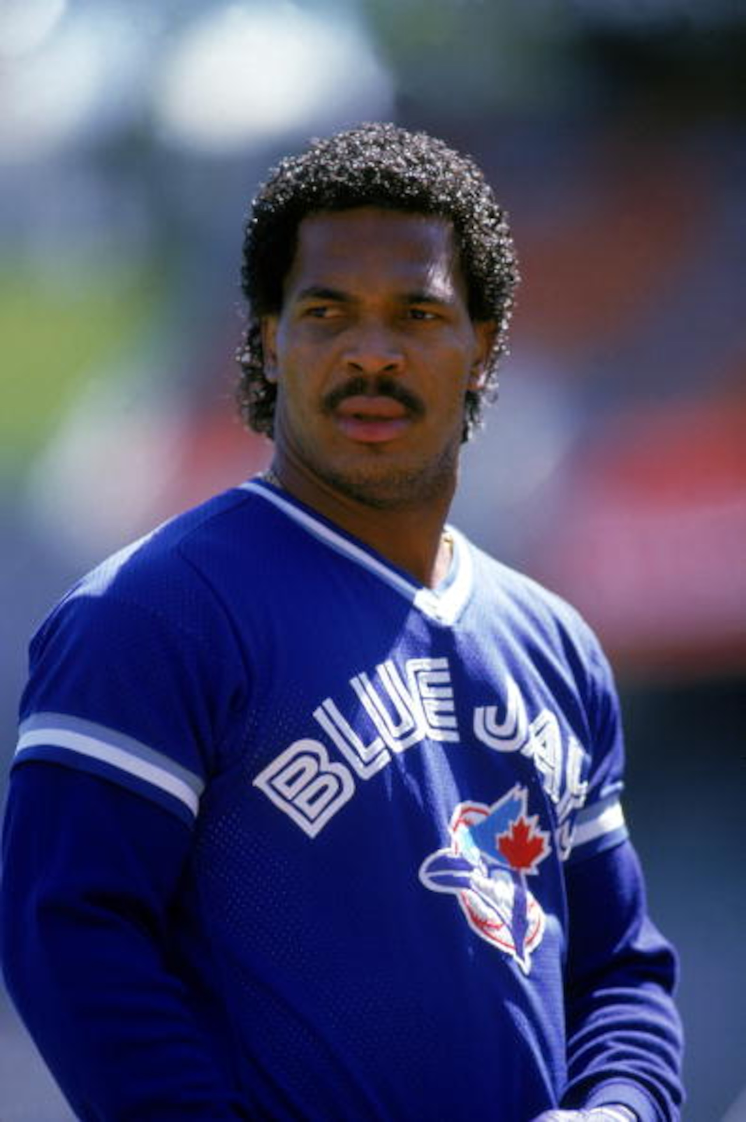 OAKLAND, CA - 1987:  George Bell #11 of the Toronto Blue Jays rests during a 1987 game against the Oakland Athletics at the Oakland-Alameda Coliseum in Oakland, California.  (Photo by Otto Greule Jr/Getty Images)