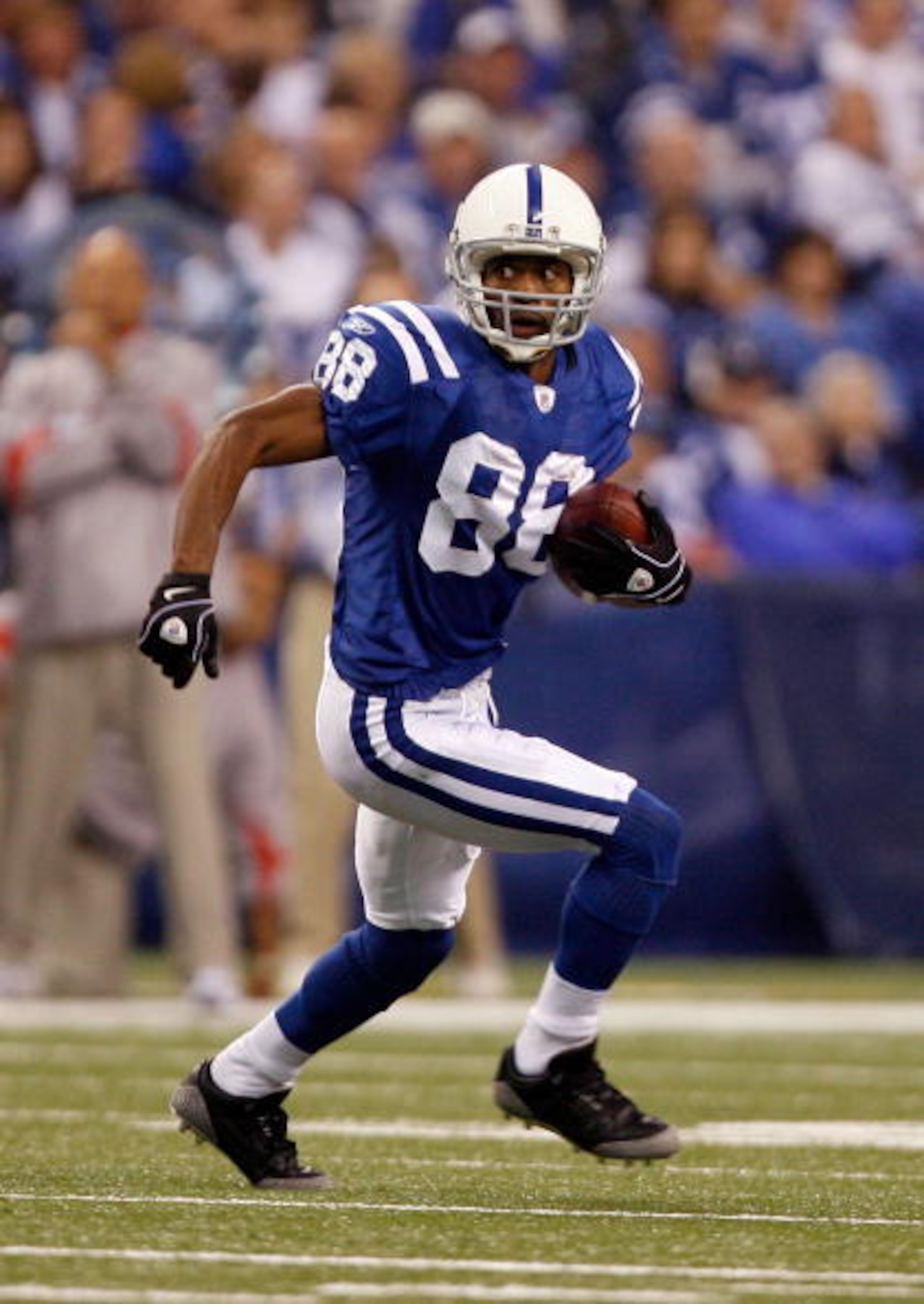 INDIANAPOLIS - NOVEMBER 16: Marvin Harrison #88 of the Indianapolis Colts runs after a catch against the Houston Texans during the game at Lucas Oil Stadium on November 17, 2008 in Indianapolis, Indiana. (Photo by Harry How/Getty Images) INDIANAPOLIS - NOVEMBER 16: Marvin Harrison #88 of the Indianapolis Colts runs after a catch against the Houston Texans during the game at Lucas Oil Stadium on November 17, 2008 in Indianapolis, Indiana. (Photo by Harry How/Getty Images)