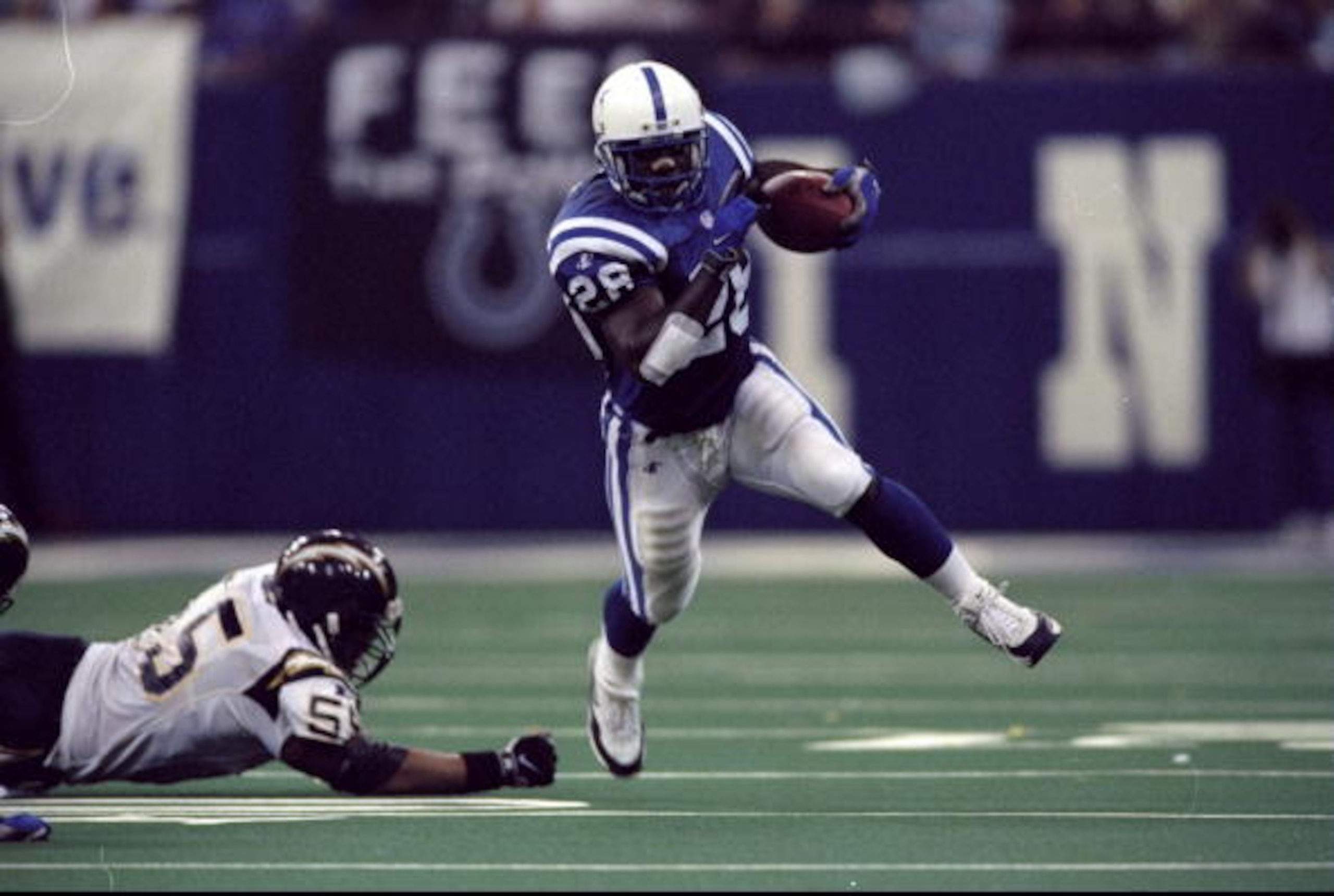 4 Oct 1998: Running back Marshall Faulk #28 of the Indianapolis Colts in action against linebacker Junior Seau #55 of the San Diego Chargers during the game at the RCA Dome in Indianapolis, Indiana. The Colts defeated the Chargers 17-12. Mandatory Credit 4 Oct 1998: Running back Marshall Faulk #28 of the Indianapolis Colts in action against linebacker Junior Seau #55 of the San Diego Chargers during the game at the RCA Dome in Indianapolis, Indiana. The Colts defeated the Chargers 17-12. Mandatory Credit