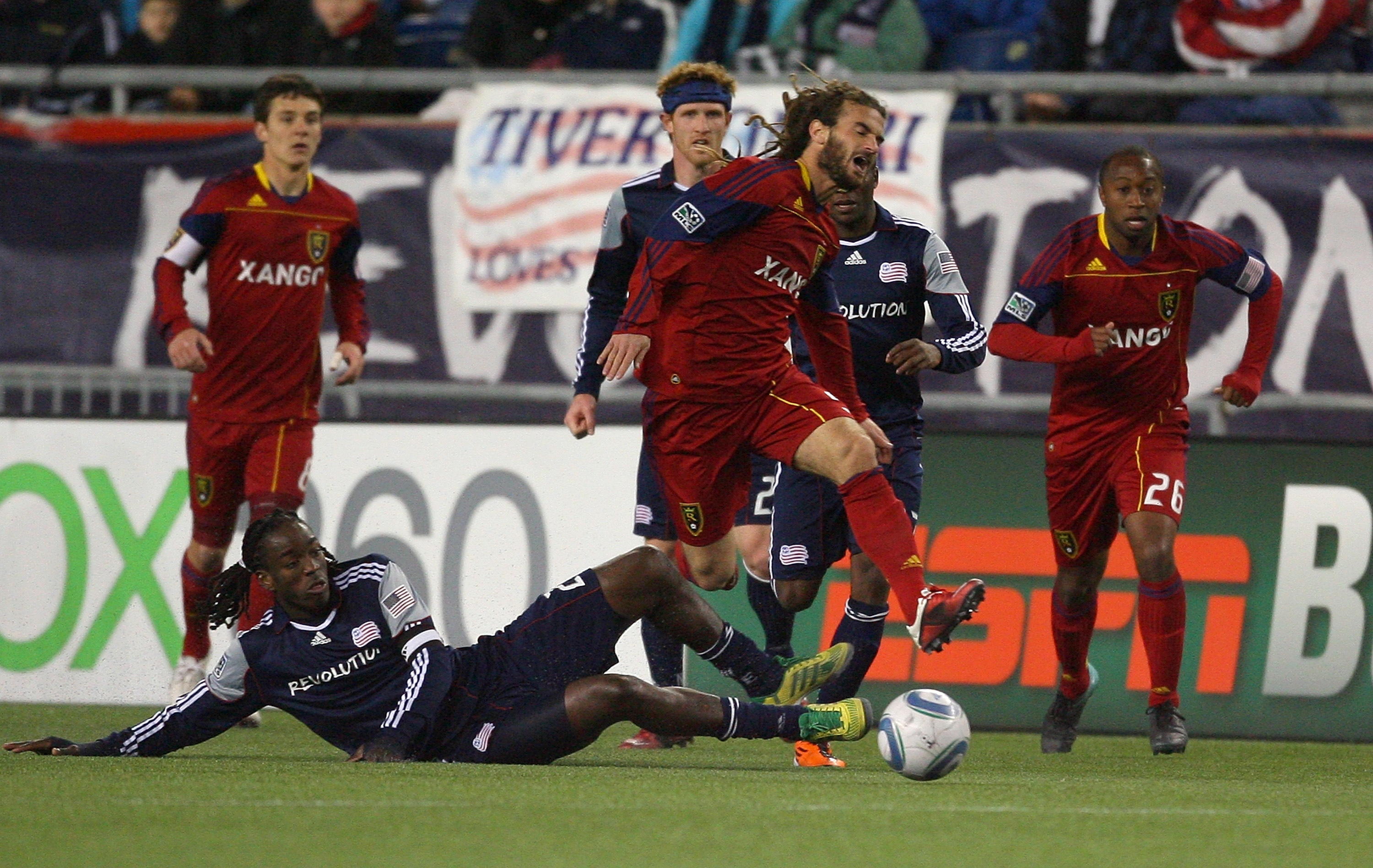FOXBORO, MA - APRIL 9:  Sharlie Joseph #21 of the New England Revolution trips is entangled with Kyle Beckerman #5 of Real Salt Lake at Gillette Stadium April 9, 2011 in Foxboro, Massachusetts. (Photo by Gail Oskin/Getty Images)
