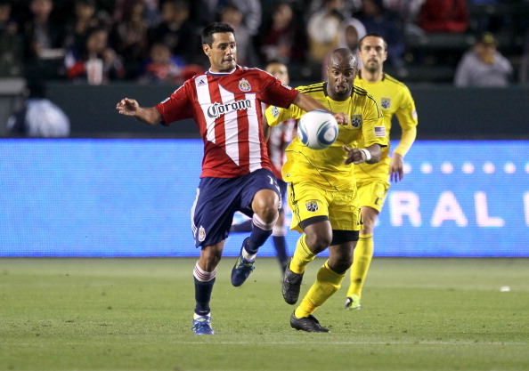CARSON, CA - APRIL 9:  Ante Jazic #13 of Chivas USA  chases the ball ahead of Emilio Renteria #20 of the Columbus Crew at The Home Depot Center on April 9, 2011 in Carson, California. The game ended in a 0-0 tie.  (Photo by Stephen Dunn/Getty Images)