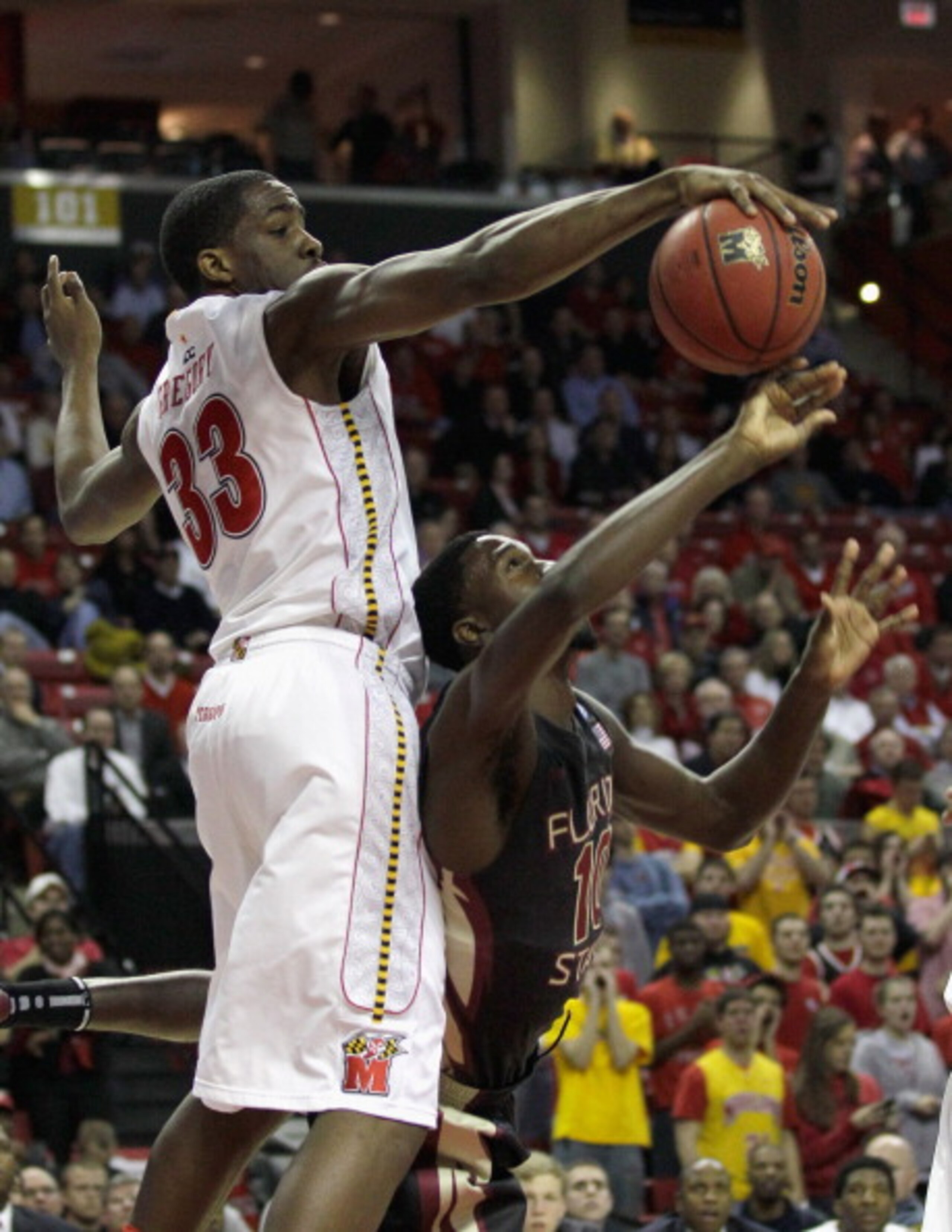 COLLEGE PARK, MD - FEBRUARY 23: Dinio Gregory #33 of the  Maryland Terrapins blocks a shot by Okaro White #3 of the Florida State Seminoles at the Comast Center on February 23, 2011 in College Park, Maryland.  (Photo by Rob Carr/Getty Images)