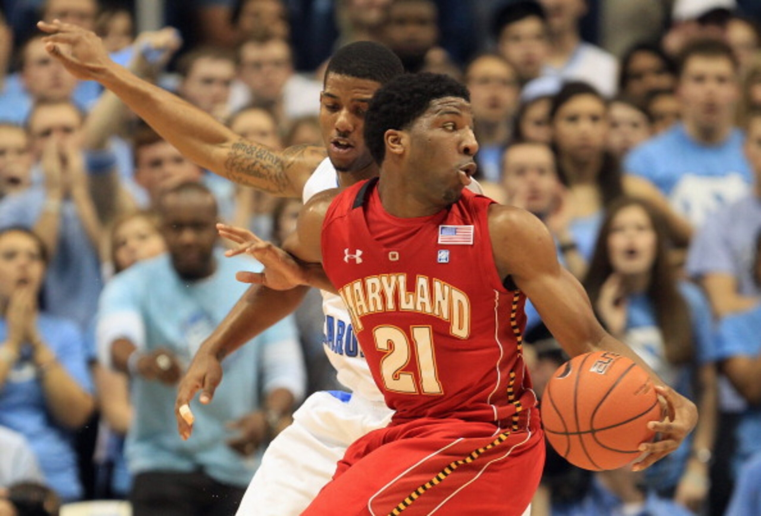 CHAPEL HILL, NC - FEBRUARY 27:  Pe'Shon Howard #21 of the Maryland Terrapins drives around Leslie McDonald #5 of the North Carolina Tar Heels during their game at the Dean E. Smith Center on February 27, 2011 in Chapel Hill, North Carolina.  (Photo by Str