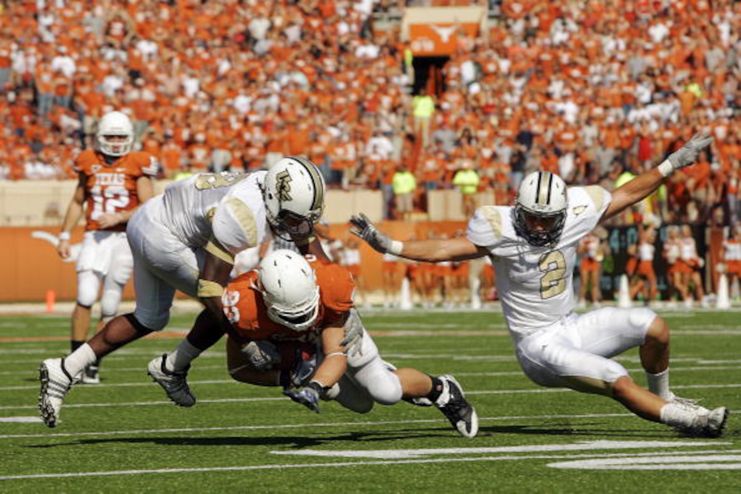 AUSTIN, TX - NOVEMBER 07:  Tight end Greg Smith #83 of the Texas Longhorns runs with a catch against the UCF Knights on November 7, 2009 at Darrell K Royal - Texas Memorial Stadium in Austin, Texas.  Texas won 35-3.  (Photo by Brian Bahr/Getty Images)