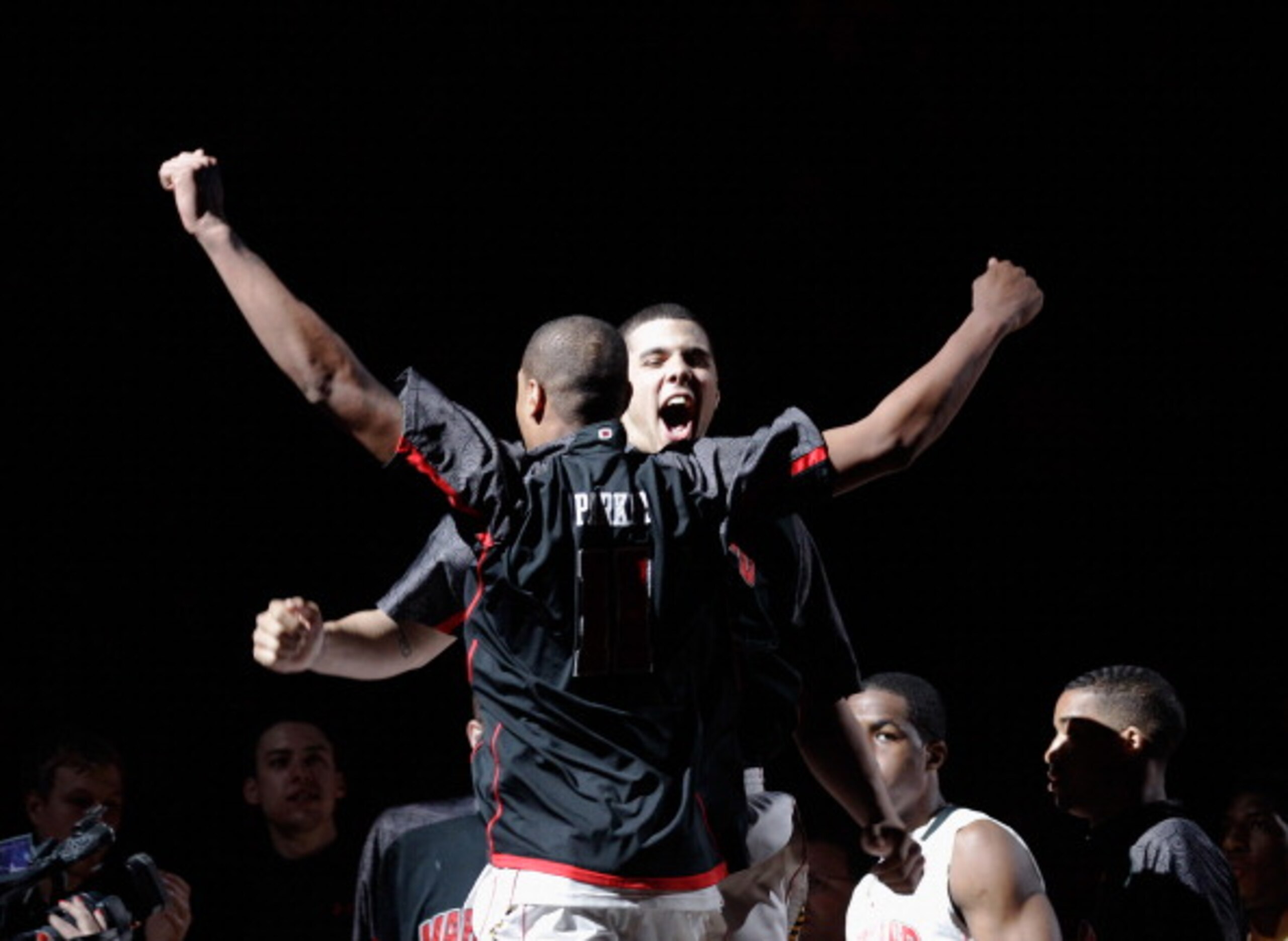 COLLEGE PARK, MD - FEBRUARY 20: Jordan Williams #20 of the Maryland Terrapins (c) and teammate Mychal Parker #11 get introduced before playing the NC State Wolfpack at the Comcast Center on February 20, 2011 in College Park, Maryland.  (Photo by Rob Carr/