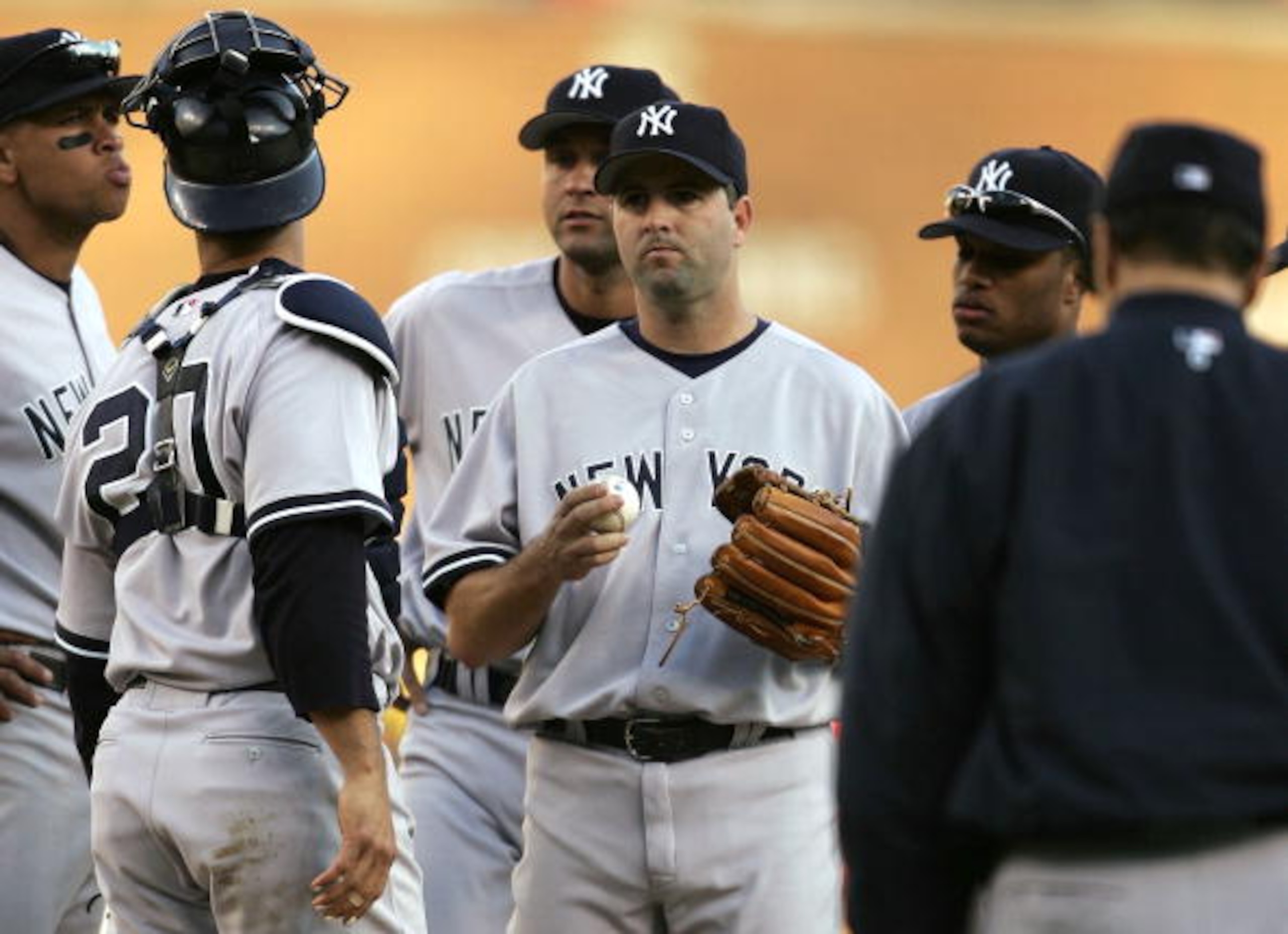 DETROIT - OCTOBER 07:  Relief pitcher Cory Lidle #30 (C - holding ball) of the New York Yankees is surrounded by teammates (L-R) Alex Rodriguez #13, Jorge Posada #20, Derek Jeter #2 and Robinson Cano #22 as manager Joe Torre walks to the mound to relieve 