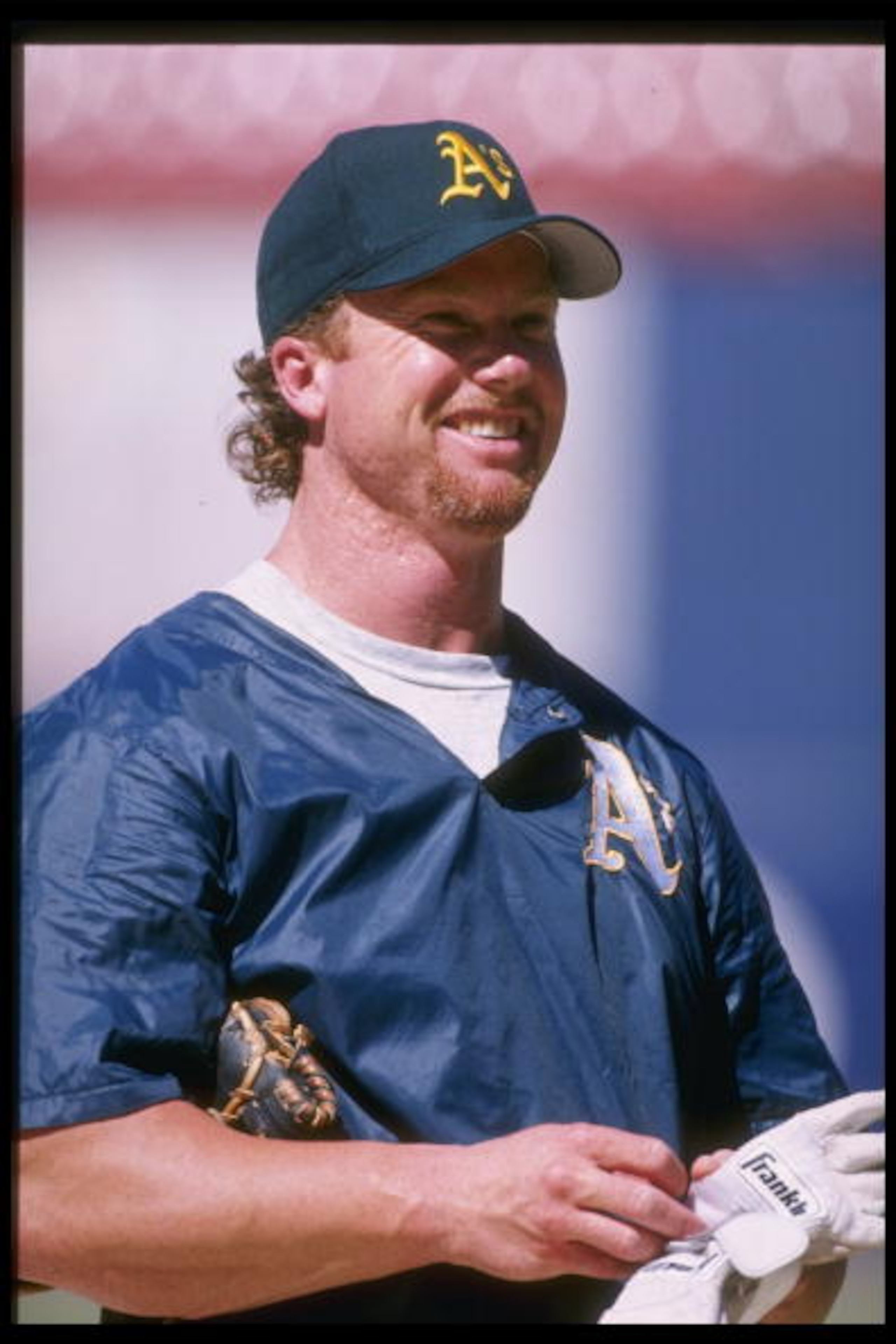 30 Jun 1996:  First baseman Mark McGwire of the Oakland A's shares a laugh with a teammate during pre game warm ups and batting practice before the A's 1-0 loss to the California Angels at Anaheim Stadium in Anaheim, California.  Mandatory Credit: Jed Jac