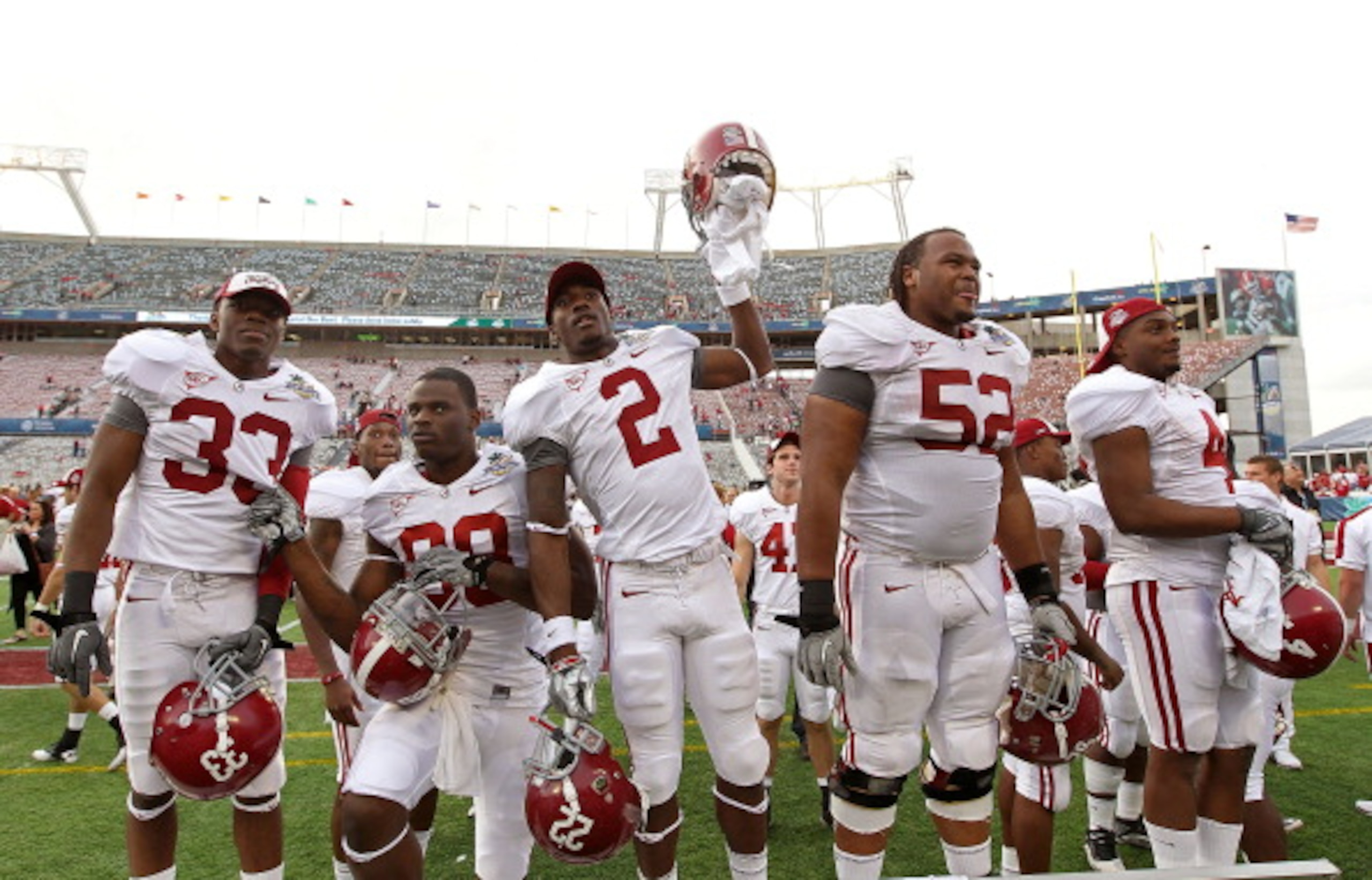 ORLANDO, FL - JANUARY 01:  Players from the Alabama Crimson Tide greet fans after winning the Capitol One Bowl against the Michigan State Spartans at the Florida Citrus Bowl on January 1, 2011 in Orlando, Florida.  (Photo by Mike Ehrmann/Getty Images)