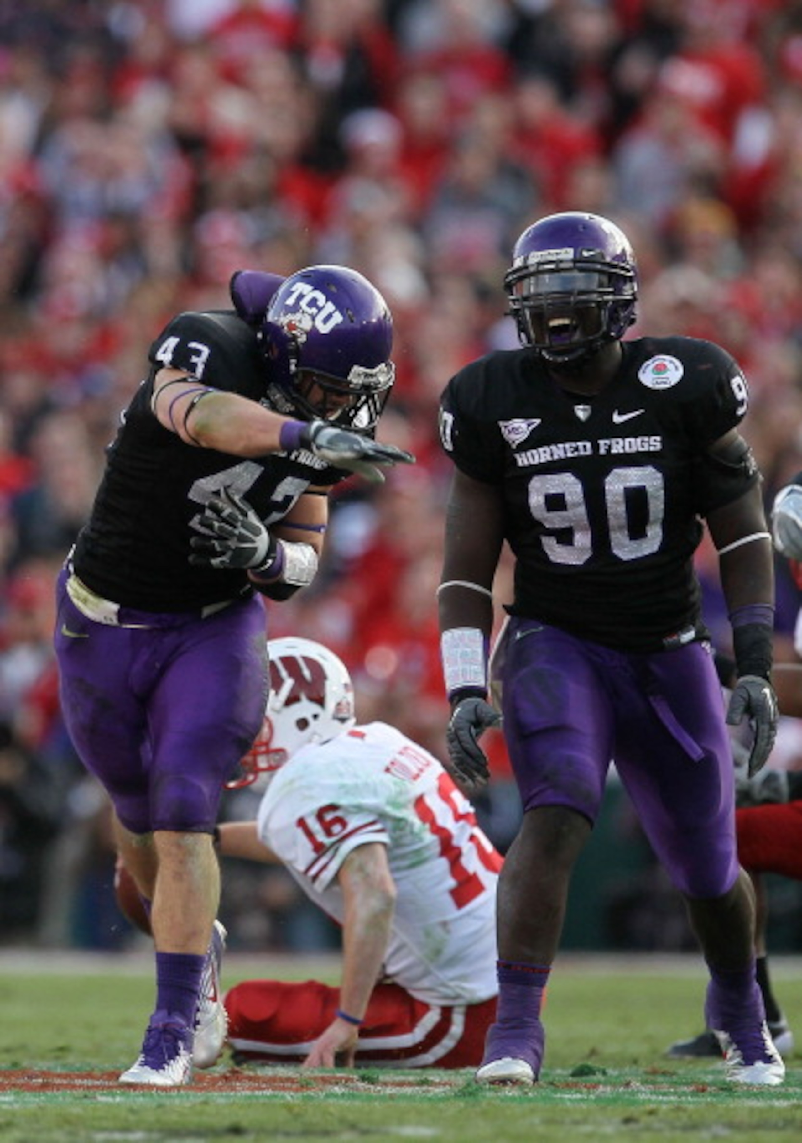 PASADENA, CA - JANUARY 01:  Linebacker Tank Carder #43 of the TCU Horned Frogs celebrates after a sack of quarterback Scott Tolzien #16 of the Wisconsin Badgers during the 97th Rose Bowl game on January 1, 2011 in Pasadena, California.  (Photo by Stephen
