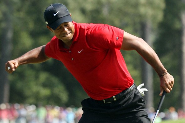 AUGUSTA, GA - APRIL 10:  Tiger Woods celebrates after holing a putt for eagle on the eighth green during the final round of the 2011 Masters Tournament on April 10, 2011 in Augusta, Georgia.  (Photo by Andrew Redington/Getty Images)