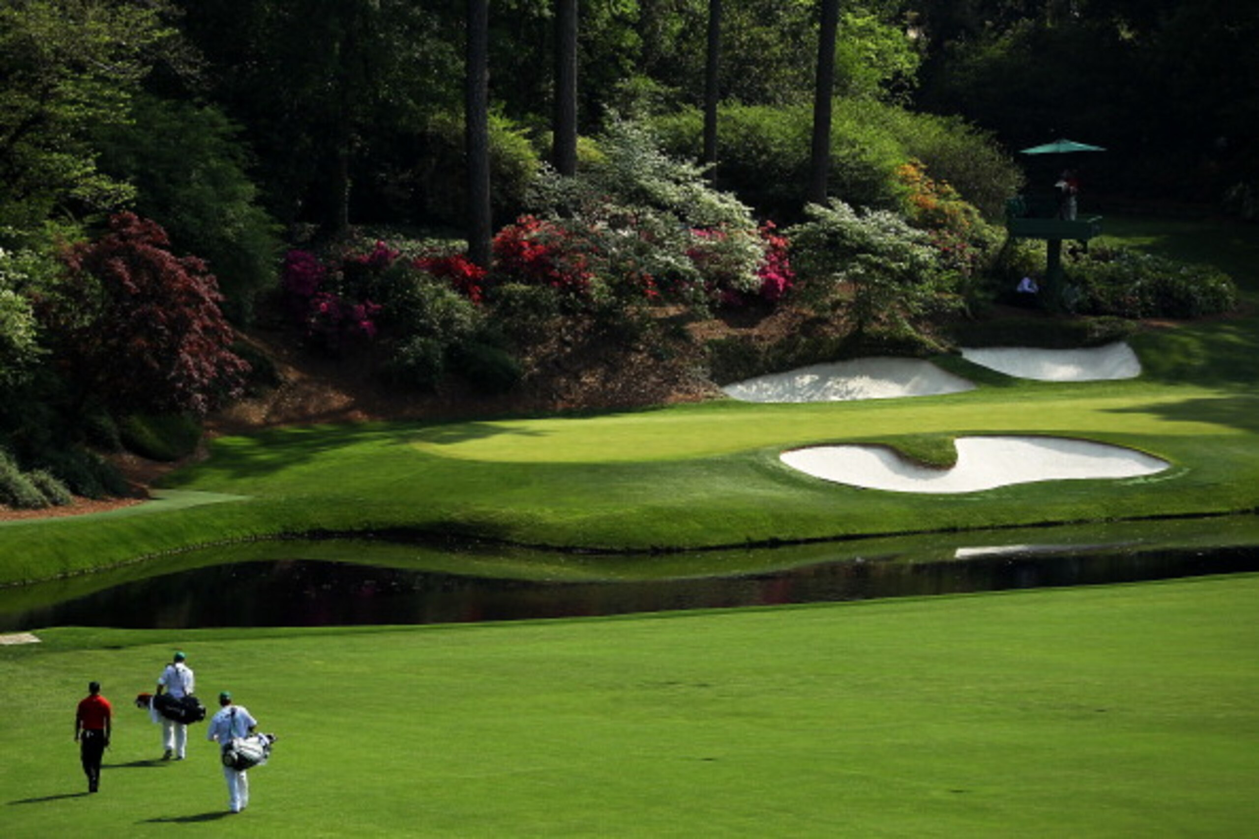 AUGUSTA, GA - APRIL 10: Tiger Woods walks to the 12th green during the final round of the 2011 Masters Tournament at Augusta National Golf Club on April 10, 2011 in Augusta, Georgia. (Photo by Jamie Squire/Getty Images) AUGUSTA, GA - APRIL 10: Tiger Woods walks to the 12th green during the final round of the 2011 Masters Tournament at Augusta National Golf Club on April 10, 2011 in Augusta, Georgia. (Photo by Jamie Squire/Getty Images)
