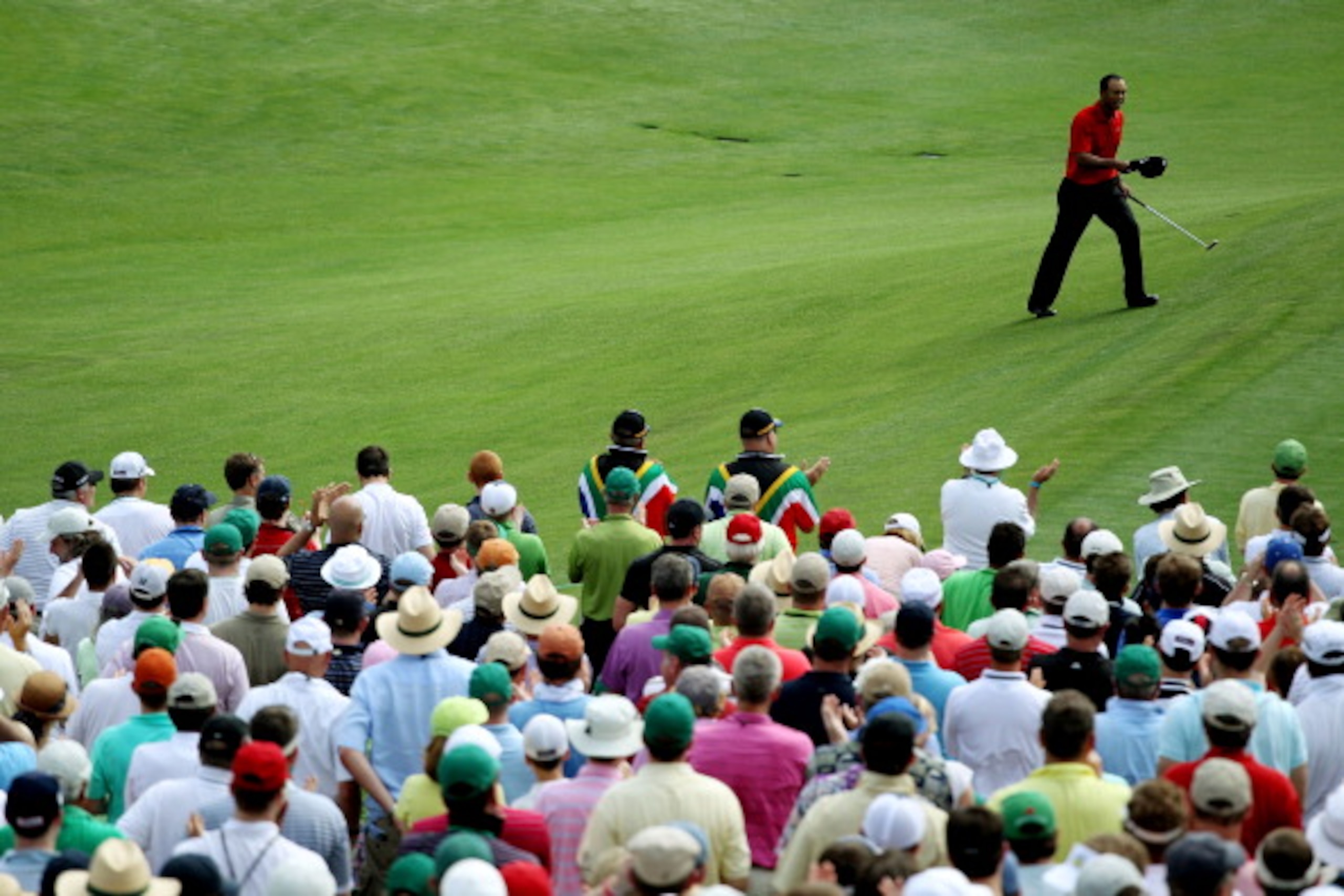 AUGUSTA, GA - APRIL 10: Patrons watch as Tiger Woods walks to the 12th tee during the final round of the 2011 Masters Tournament at Augusta National Golf Club on April 10, 2011 in Augusta, Georgia. (Photo by Jamie Squire/Getty Images) AUGUSTA, GA - APRIL 10: Patrons watch as Tiger Woods walks to the 12th tee during the final round of the 2011 Masters Tournament at Augusta National Golf Club on April 10, 2011 in Augusta, Georgia. (Photo by Jamie Squire/Getty Images)