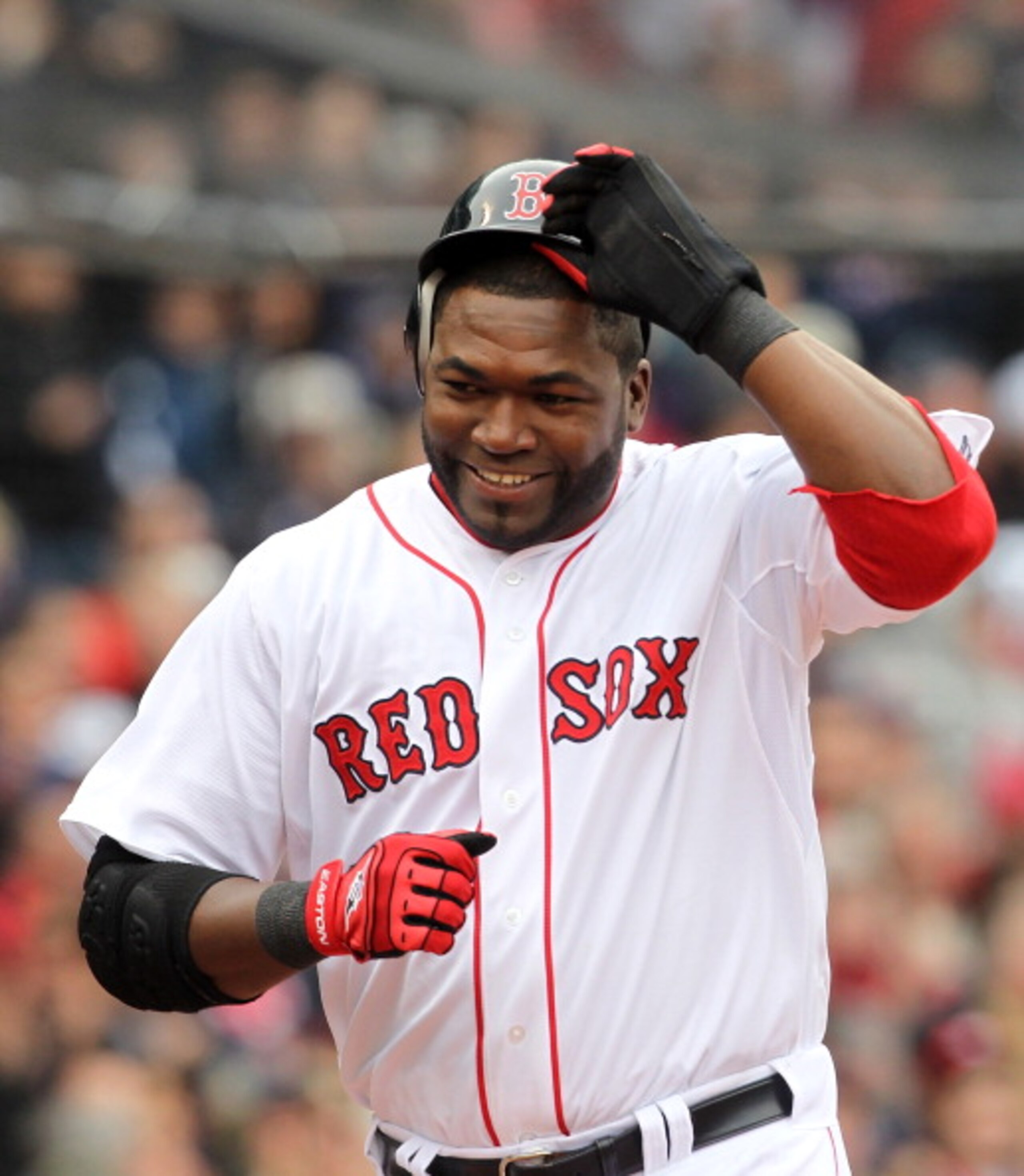 BOSTON, MA - APRIL 8:  David Ortiz #34 of the Boston Red Sox reacts after scoring a run against the New York Yankees during Opening Day at Fenway Park on April 8, 2011 in Boston, Massachusetts. (Photo by Jim Rogash/Getty Images)