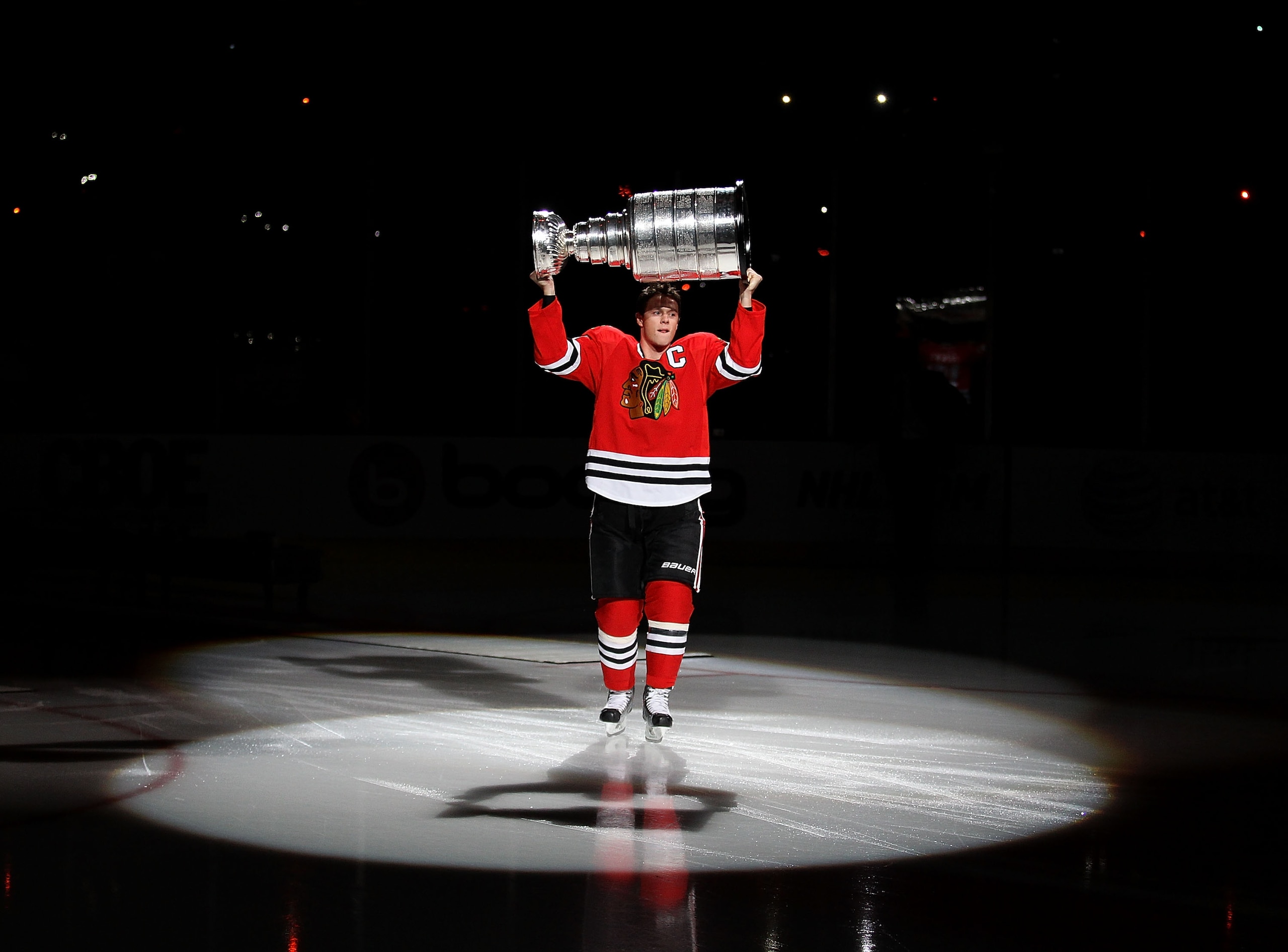 CHICAGO - OCTOBER 09: Jonathan Toews #19 of the Chicago Blackhawks carries the Stanley Cup across the ice in a ceremony before the Blackhawks season home opening game against the Detroit Red Wings at the United Center on October 9, 2010 in Chicago, Illino CHICAGO - OCTOBER 09: Jonathan Toews #19 of the Chicago Blackhawks carries the Stanley Cup across the ice in a ceremony before the Blackhawks season home opening game against the Detroit Red Wings at the United Center on October 9, 2010 in Chicago, Illino