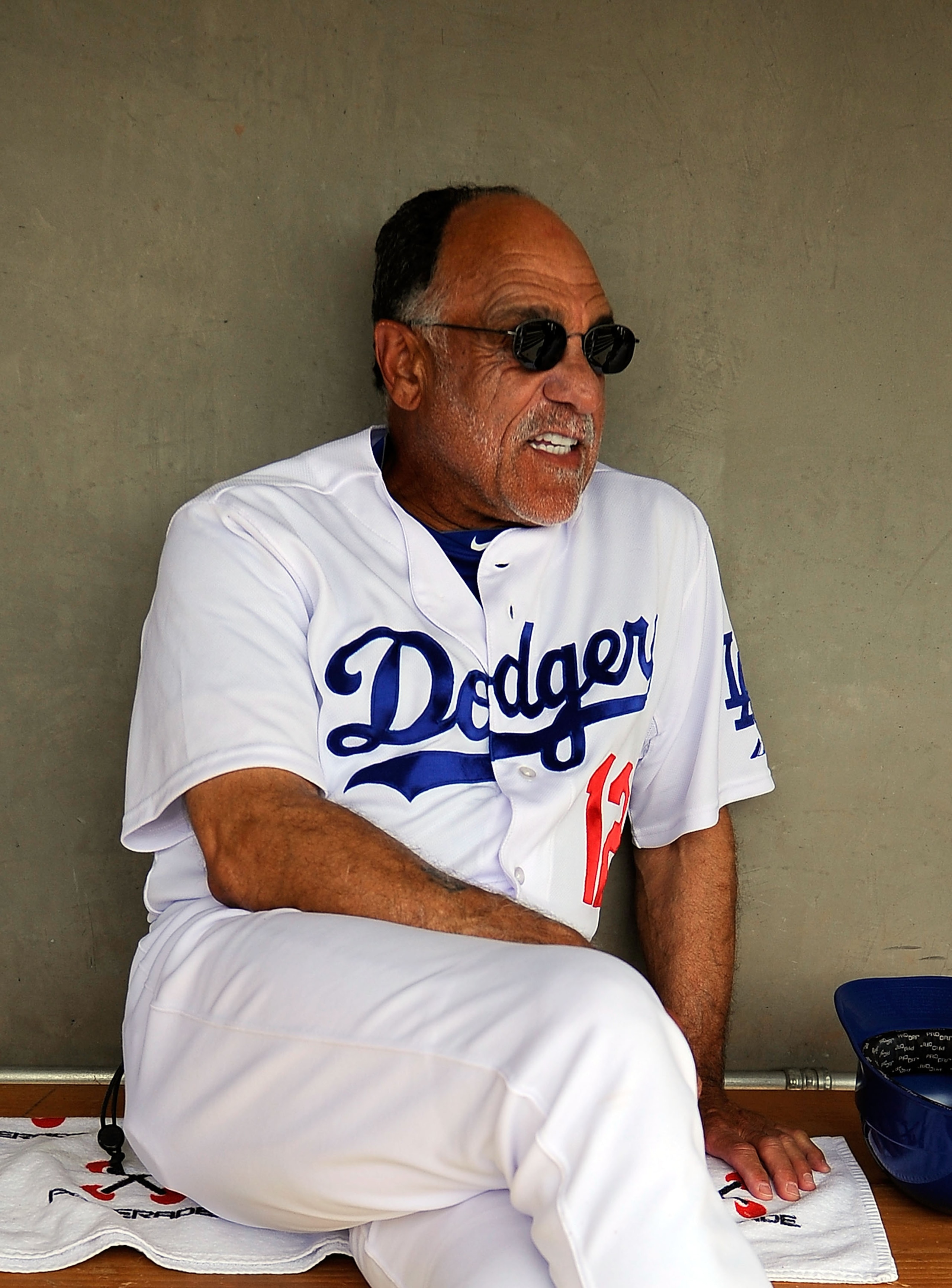 GLENDALE, AZ - MARCH 15:  First base coach Davey Lopes of the Los Angeles Dodgers sits in the dugout prior to the start of the spring training baseball game against the Texas Rangers at Camelback Ranch on March 15, 2011 in Glendale, Arizona.  (Photo by Ke