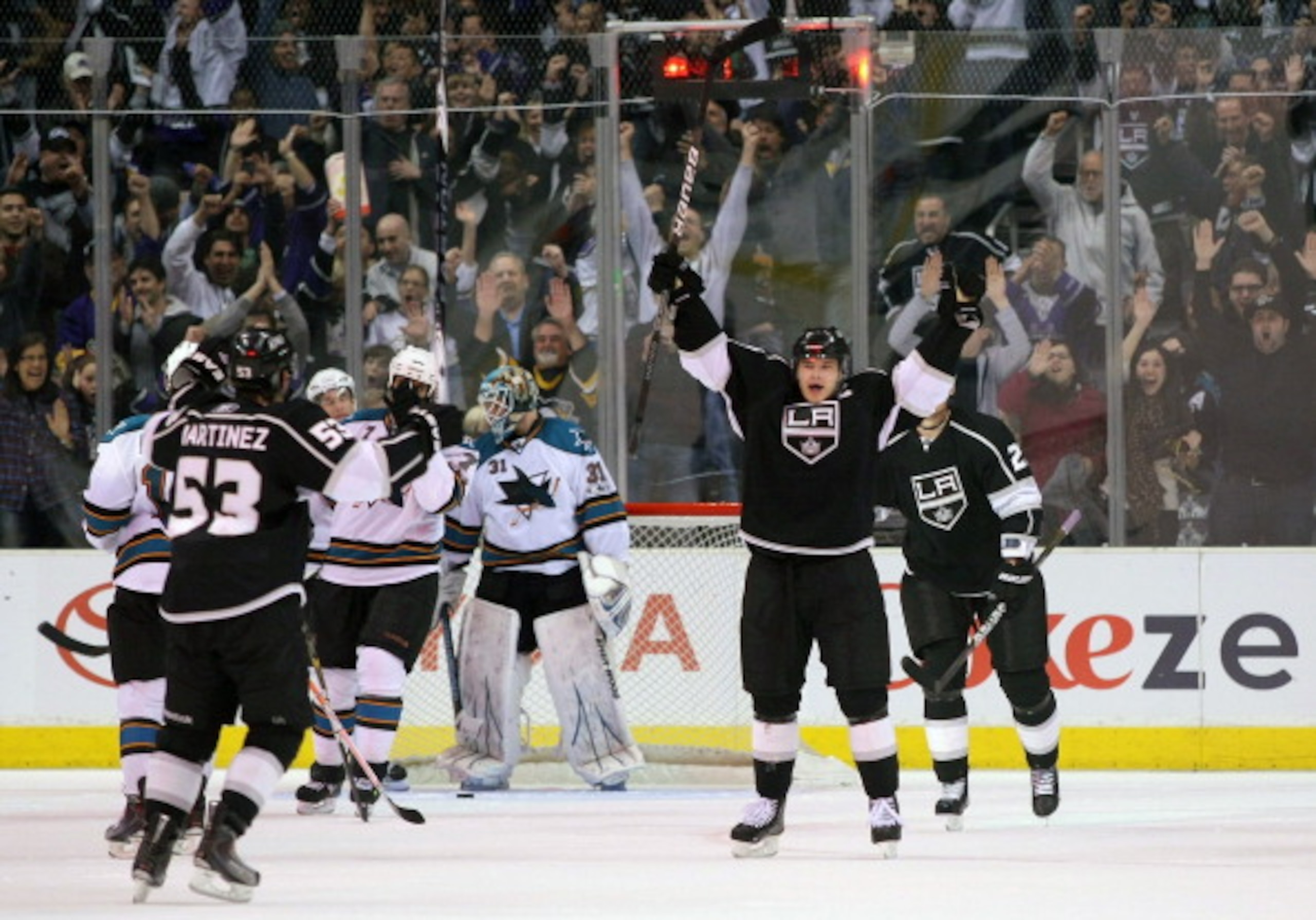 LOS ANGELES, CA - MARCH 24: Dustin Brown #23 of the Los Angeles Kings reacts after scoring against goaltender Antti Niemi #31 of the San Jose Sharks in the third period during the NHL game at Staples Center on March 24, 2011 in Los Angeles, California. T LOS ANGELES, CA - MARCH 24: Dustin Brown #23 of the Los Angeles Kings reacts after scoring against goaltender Antti Niemi #31 of the San Jose Sharks in the third period during the NHL game at Staples Center on March 24, 2011 in Los Angeles, California. T