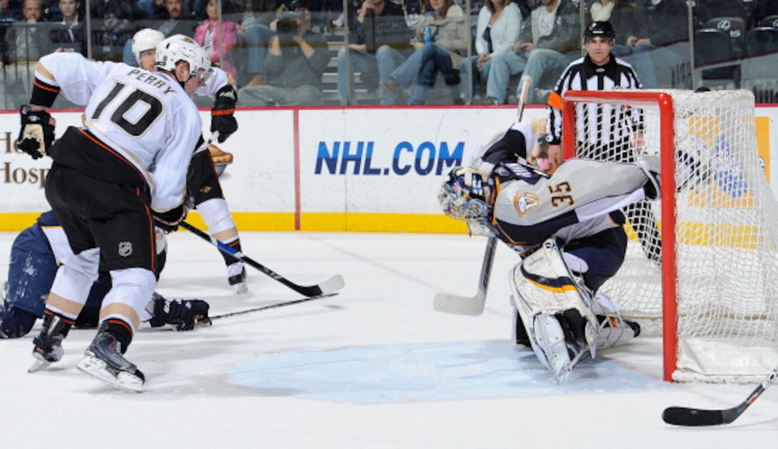NASHVILLE, TN - MARCH 24: Corey Perry #10 of the Anaheim Ducks watches a puck shot by teammate Teemu Selanne #8 get past Pekka Rinne #35 of the Nashville Predators for a goal on March 24, 2011 at the Bridgestone Arena in Nashville, Tennessee. (Photo by F NASHVILLE, TN - MARCH 24: Corey Perry #10 of the Anaheim Ducks watches a puck shot by teammate Teemu Selanne #8 get past Pekka Rinne #35 of the Nashville Predators for a goal on March 24, 2011 at the Bridgestone Arena in Nashville, Tennessee. (Photo by F